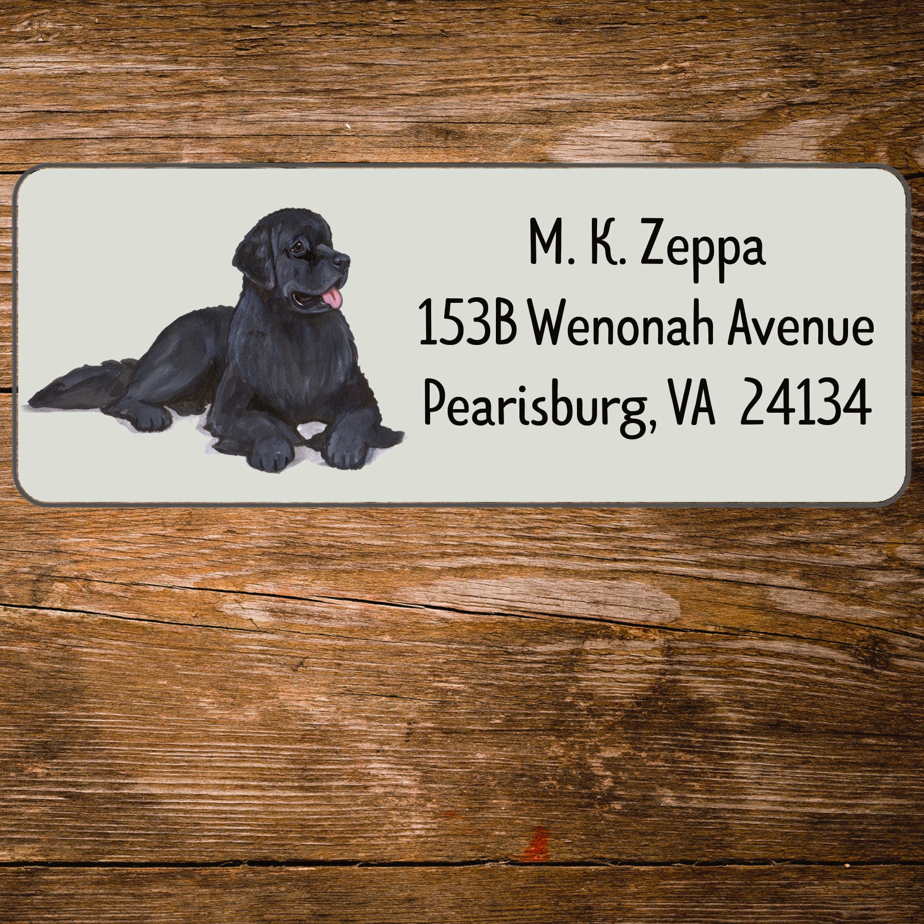 Return address label with a Newfoundland illustration.