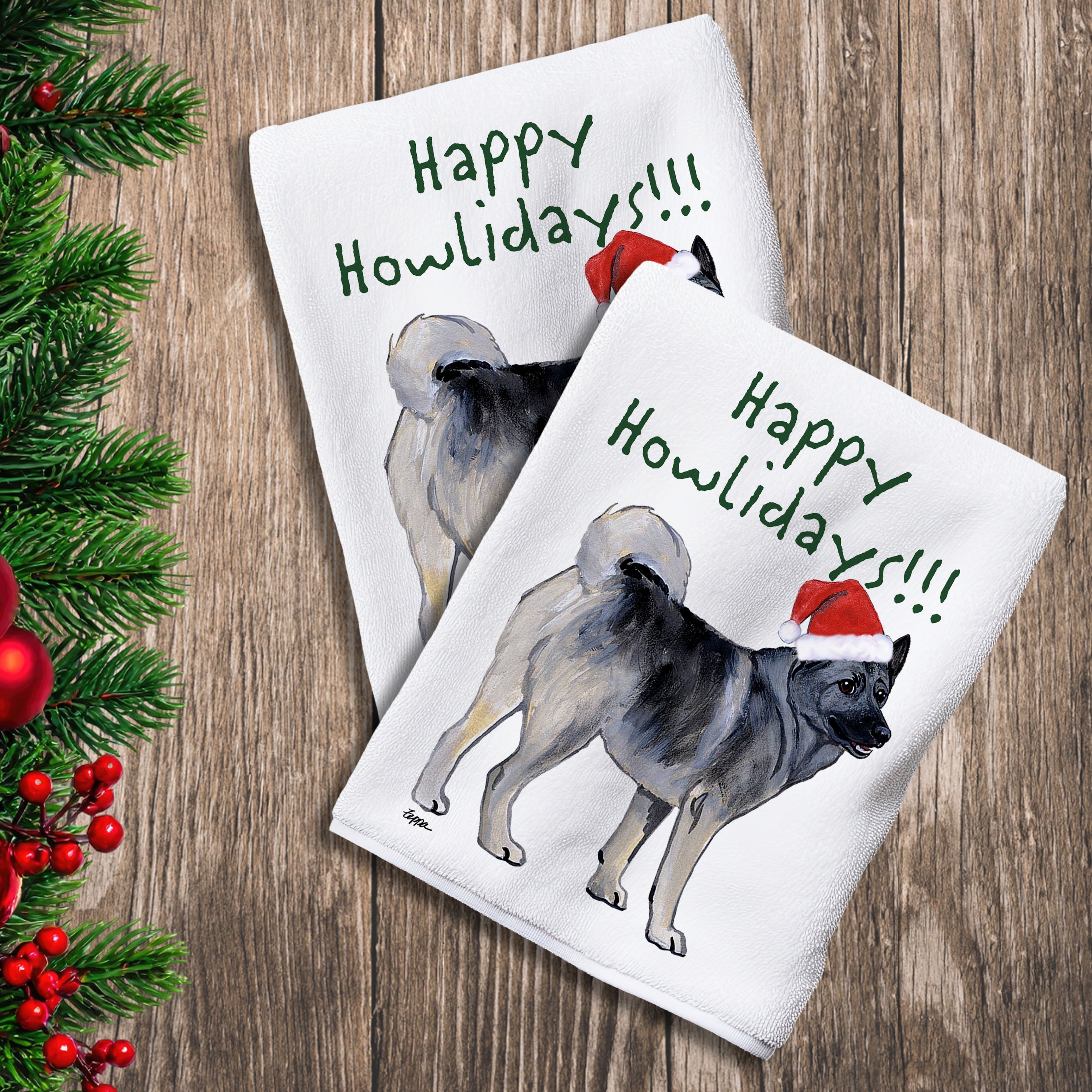 2 Kitchen Towels with a Norwegian Elkhound in a Santa Hat and Happy Howlidays text.
