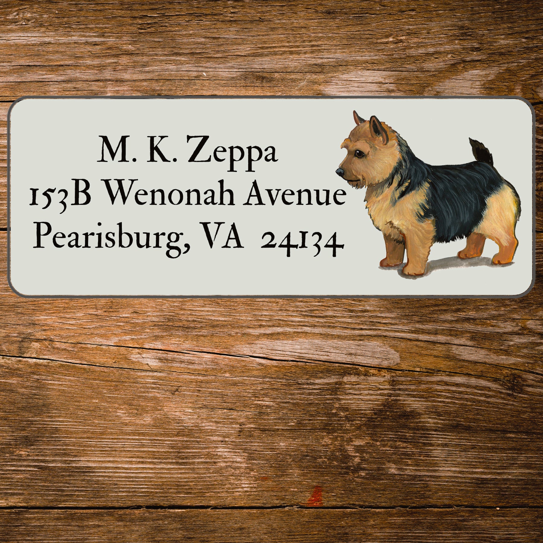 Return address label with a Norwich Terrier illustration.