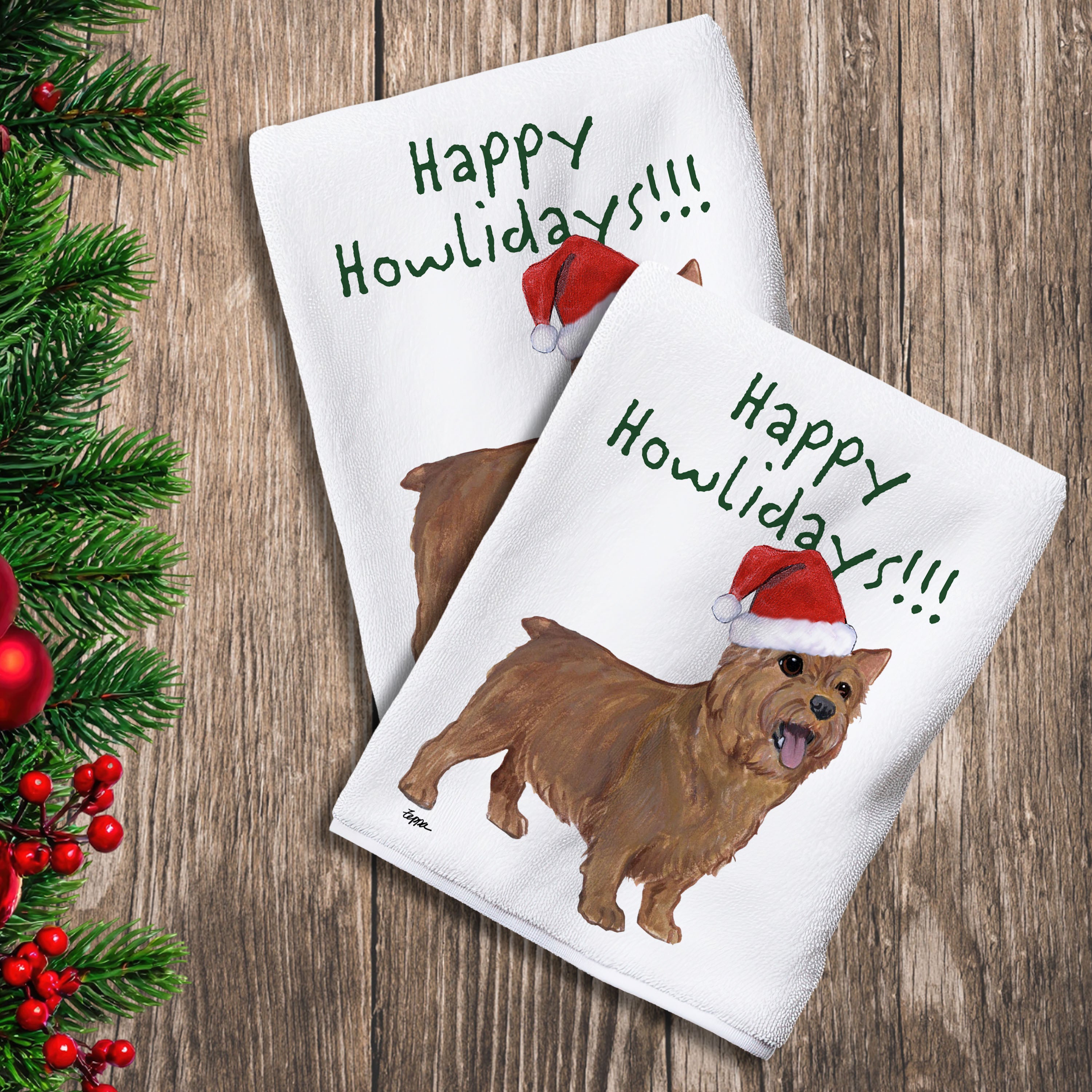 2 Kitchen Towels with a Norwich Terrier in a Santa Hat and Happy Howlidays text.
