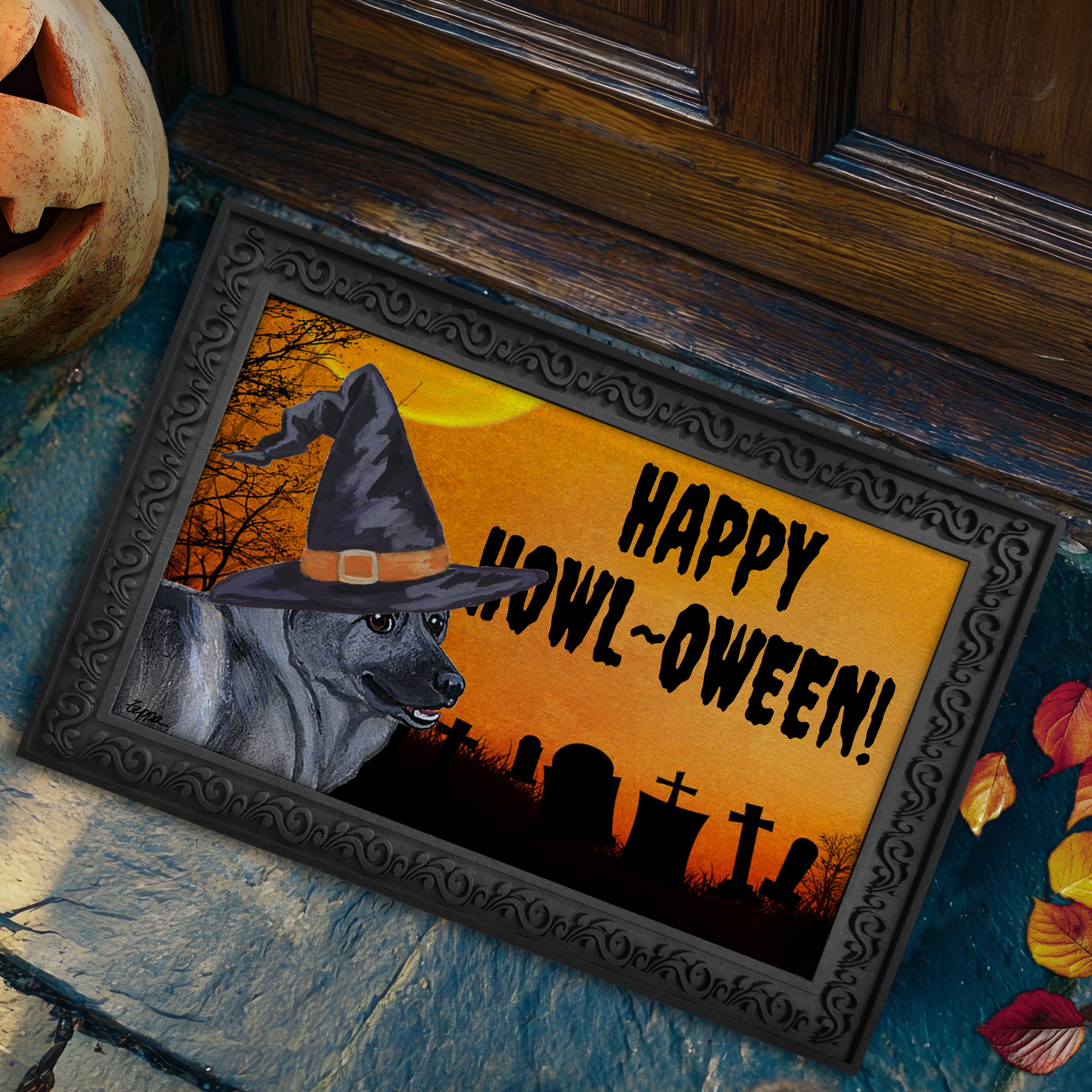 Halloween-themed doormat with a Norwegian Elkhound wearing a witch hat and 'Happy Howl-Oween!' text, placed on a stone step.