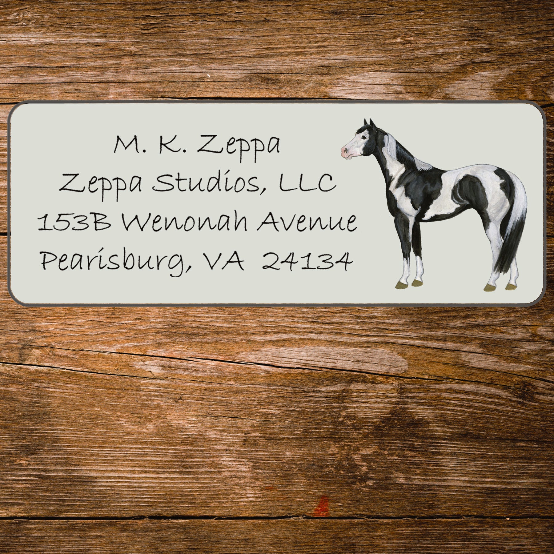 Return address label with an illustration of a Paint Horse.