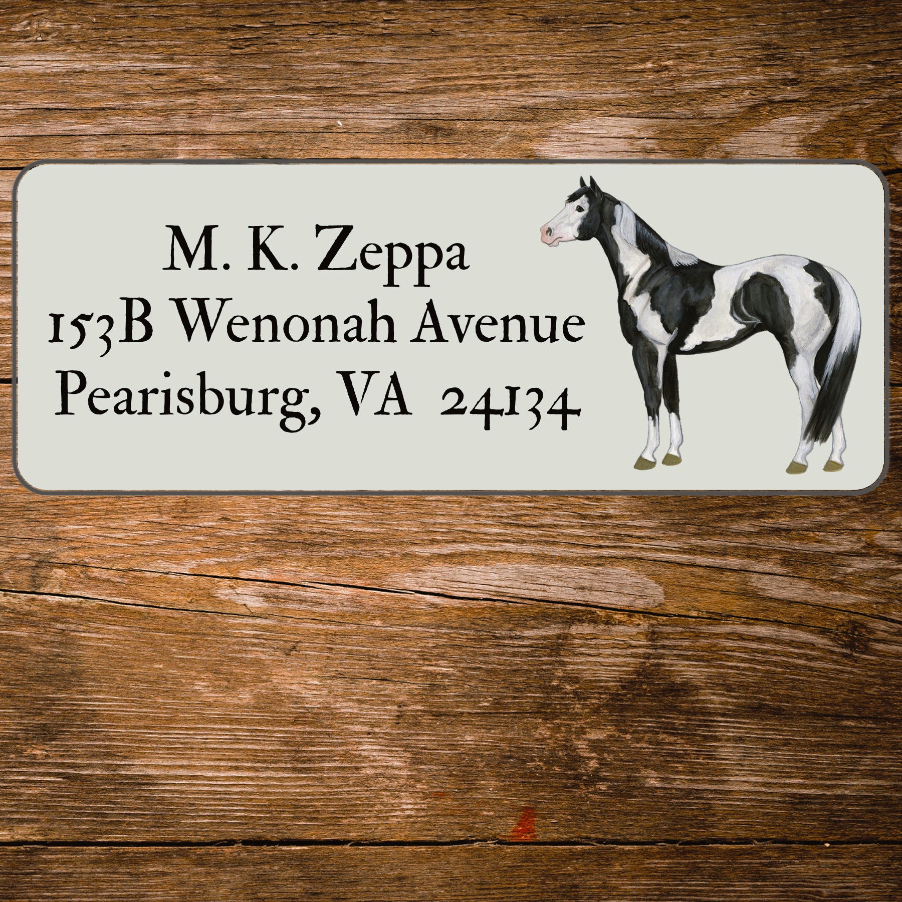 Return address label with an illustration of a Paint Horse.