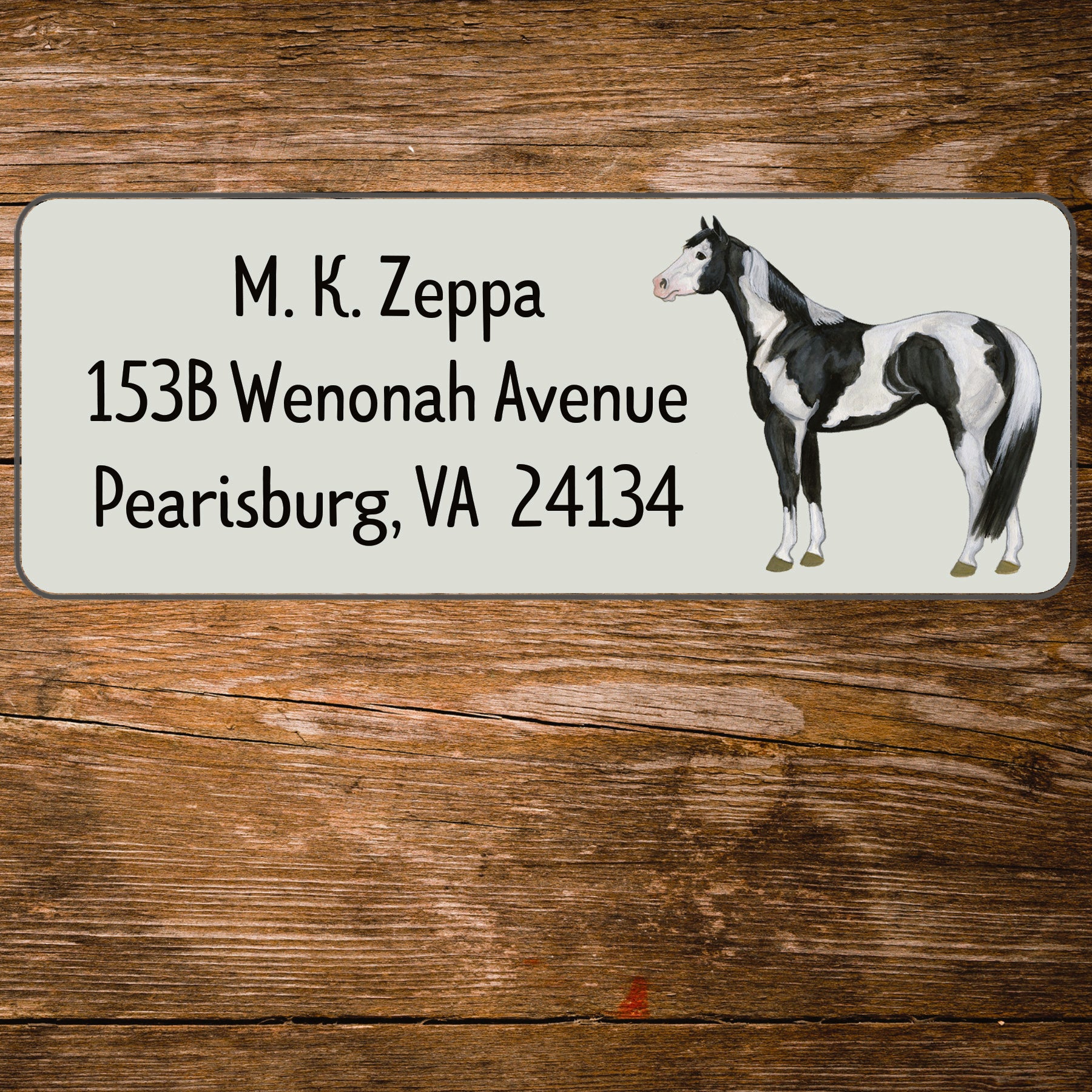 Return address label with an illustration of a Paint Horse.