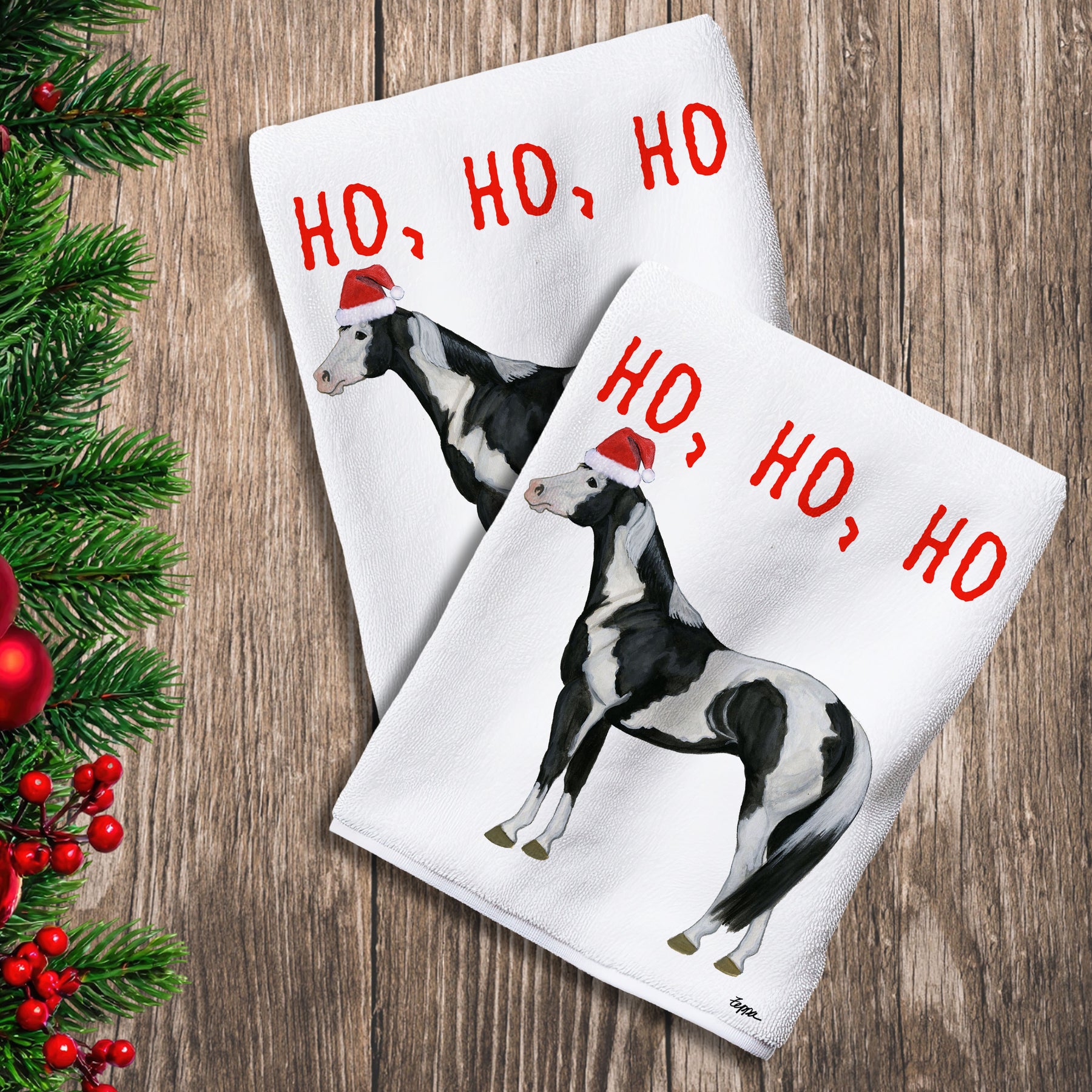 2 Kitchen Towels with a Paint horse in a Santa Hat and Ho Ho Ho text.

