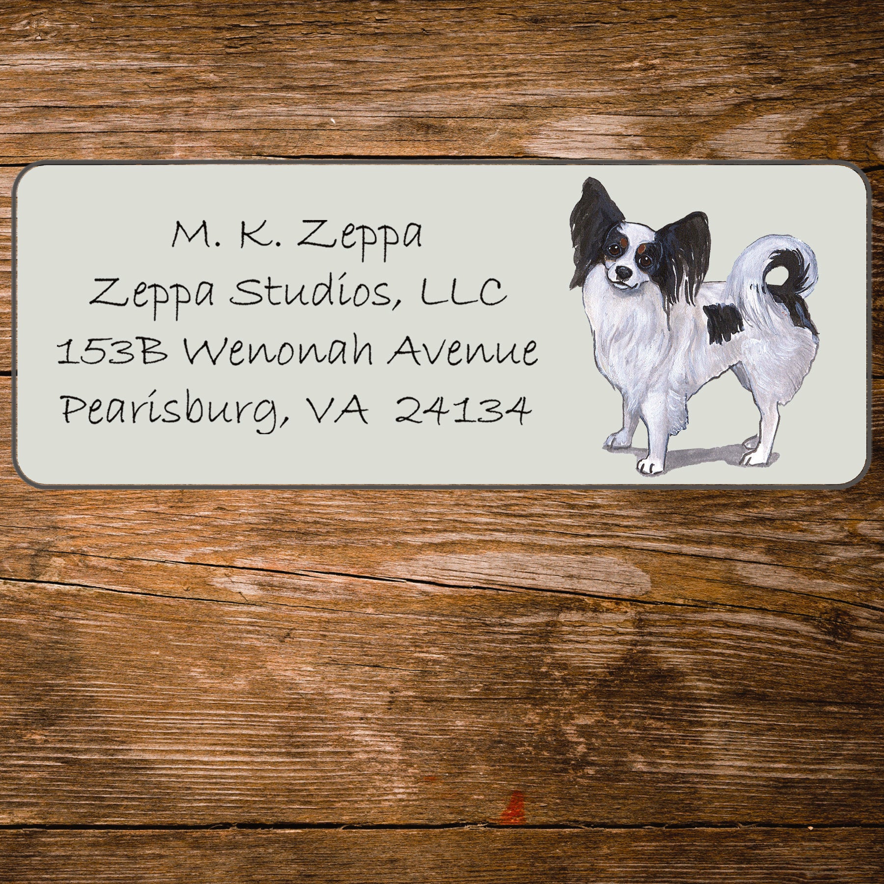 Return address label with a Papillon dog illustration.
