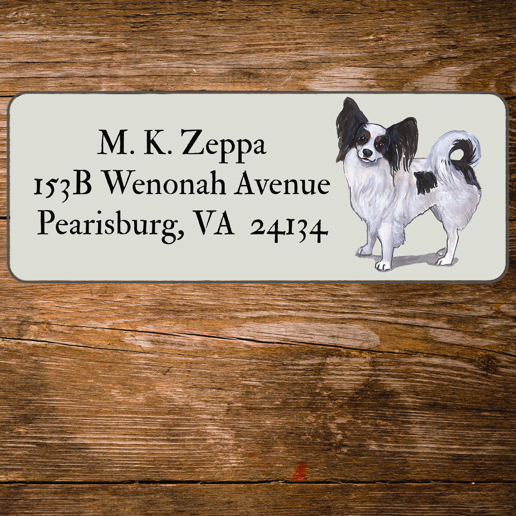 Return address label with a Papillon dog illustration.