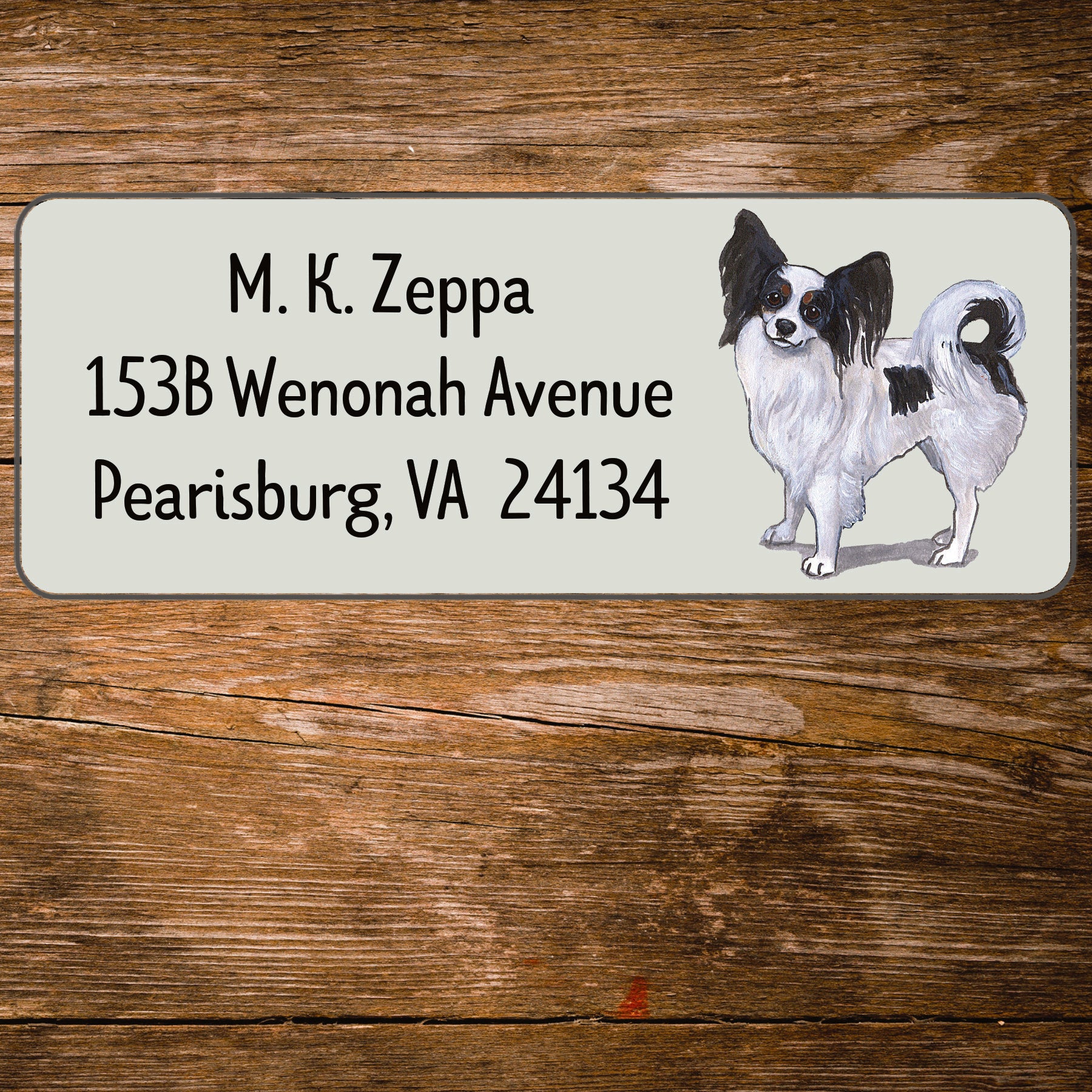 Return address label with a Papillon dog illustration.