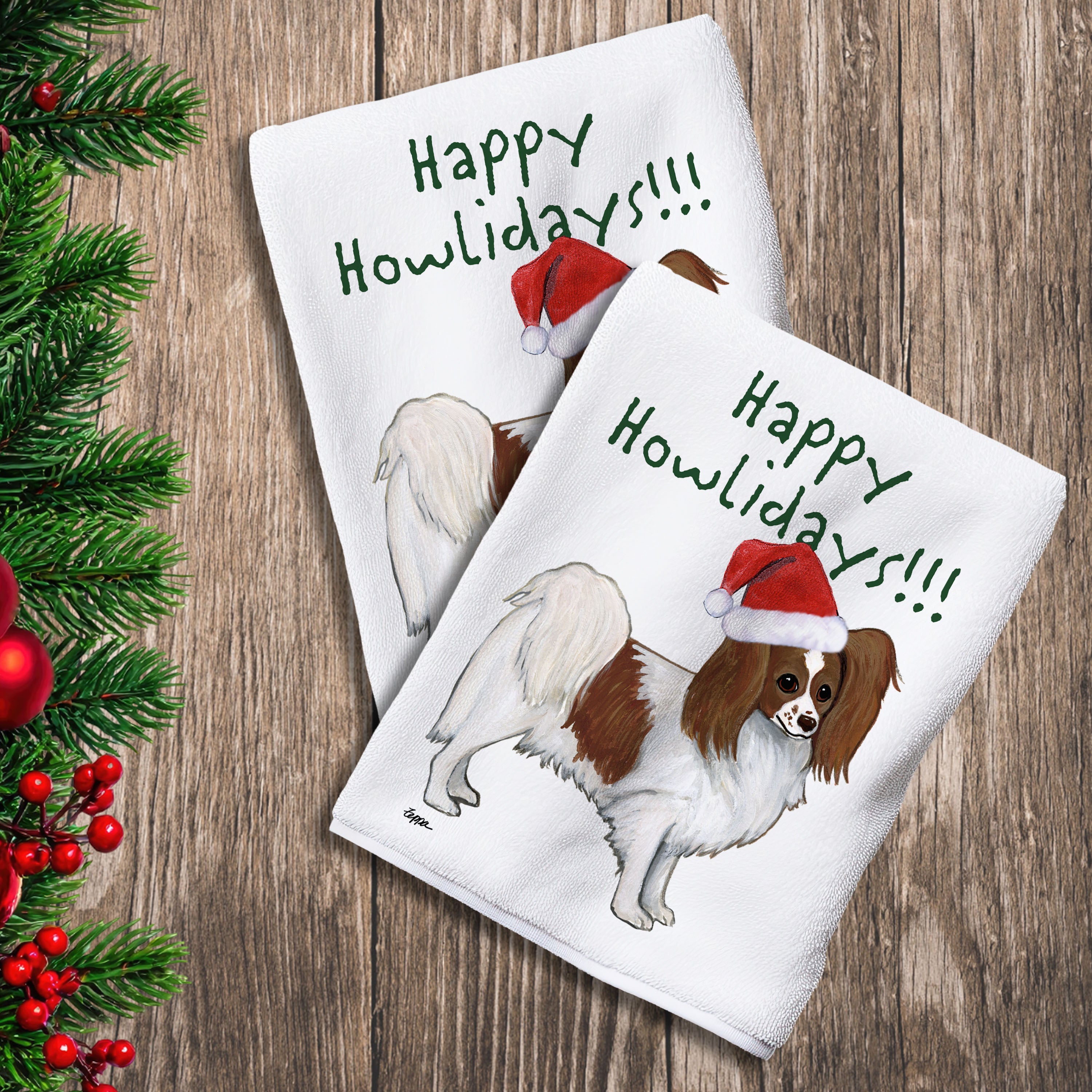 2 Kitchen Towels with a red and white Papillon in a Santa Hat and Happy Howlidays text.
