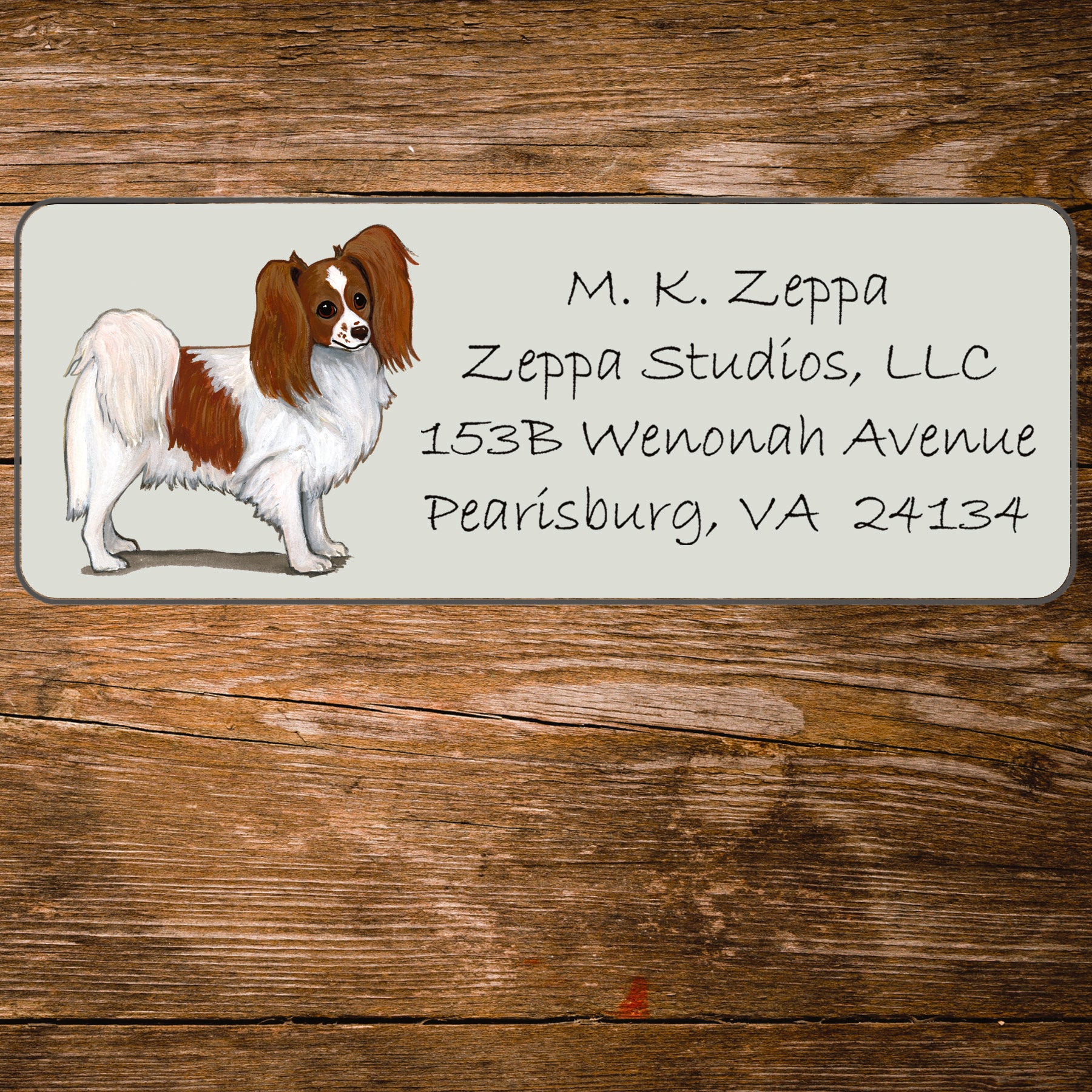 Return address label with a Papillon dog illustration.