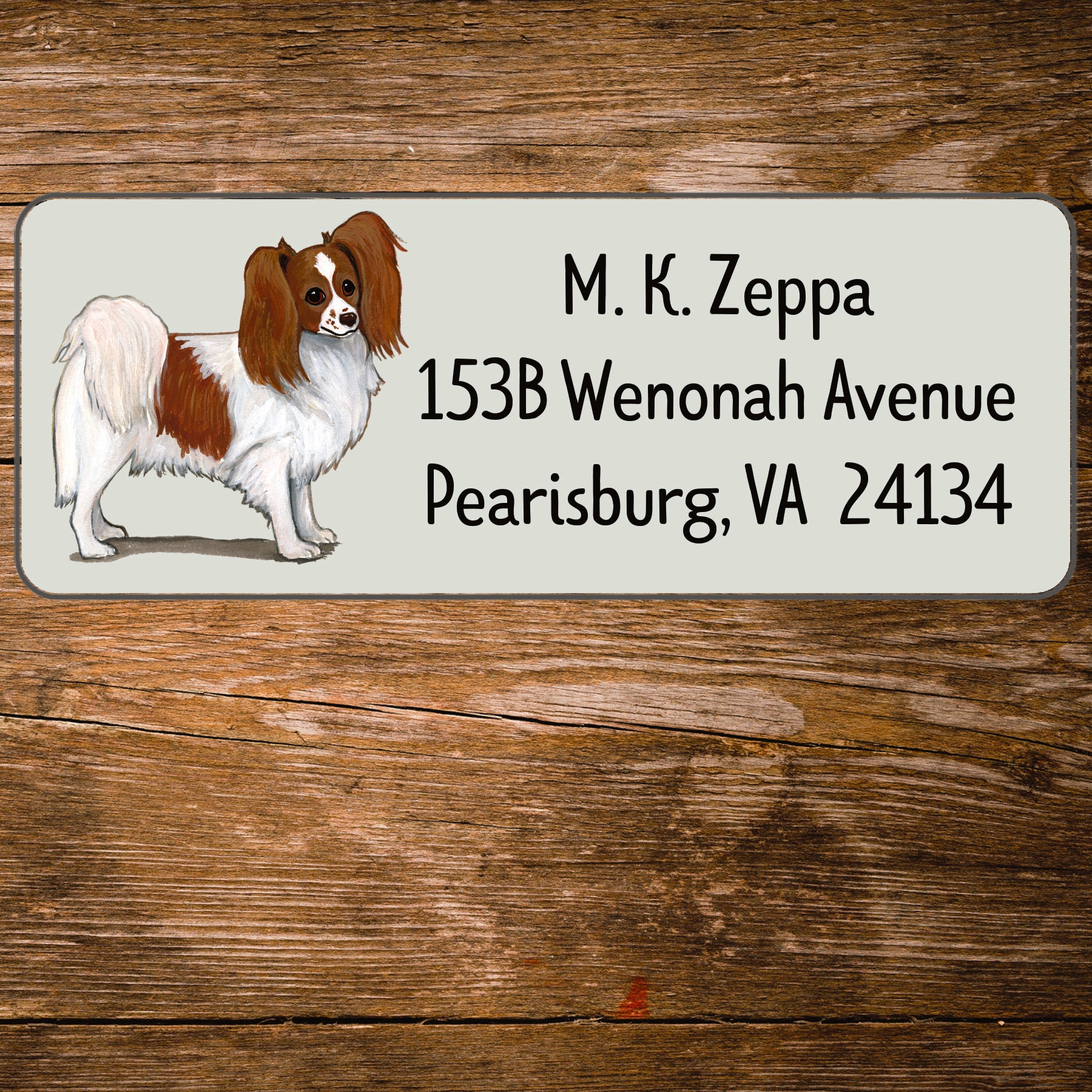 Return address label with a Papillon dog illustration.