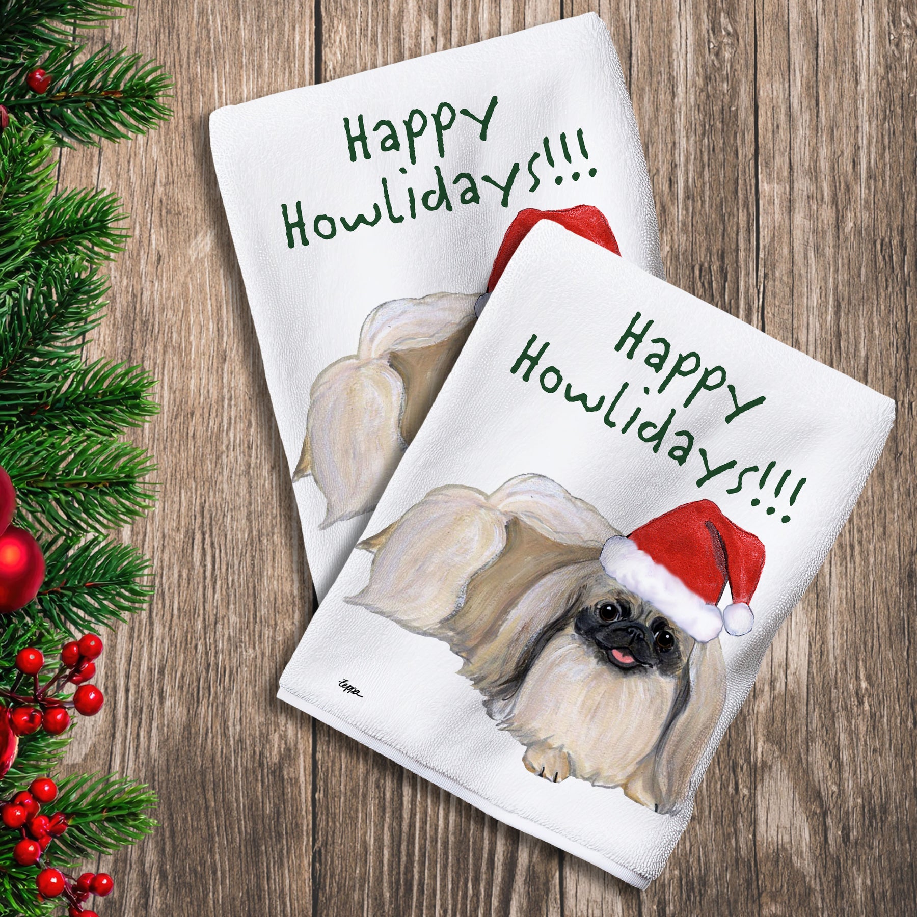 2 Kitchen Towels with a Pekingese in a Santa Hat and Happy Howlidays text.
