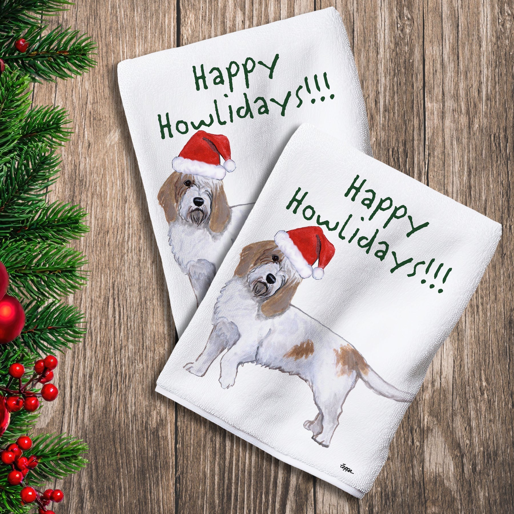 2 Kitchen Towels with a Petite Basset Griffon Vendeen in a Santa Hat and Happy Howlidays text.
