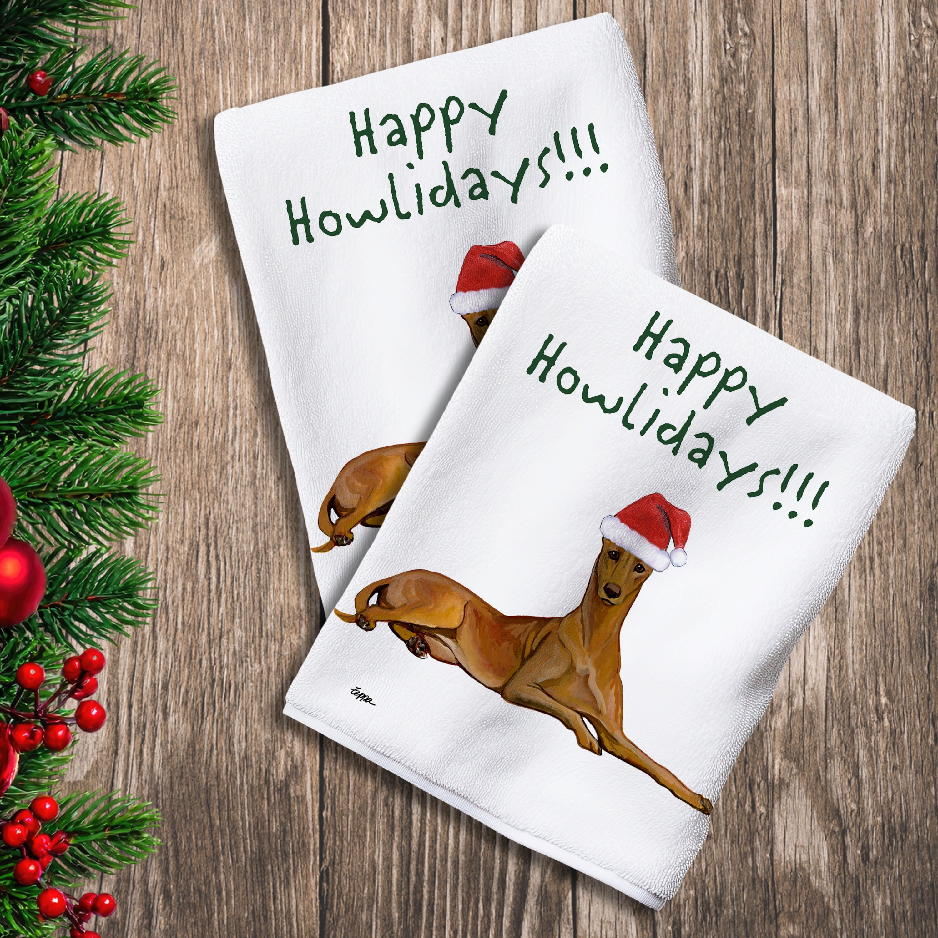 2 Kitchen Towels with a Pharaoh Hound in a Santa Hat and Happy Howlidays text.
