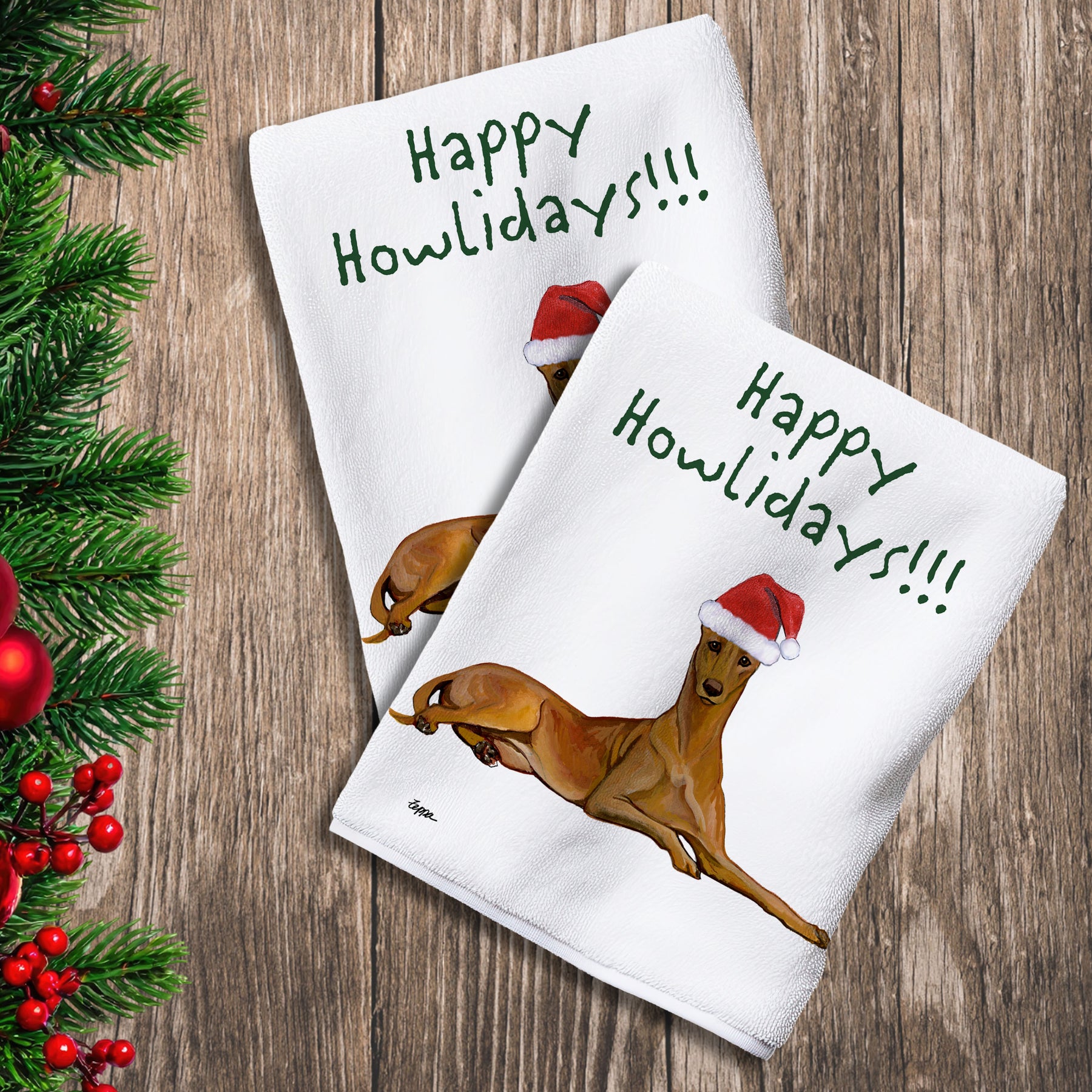 2 Kitchen Towels with a Pharaoh Hound in a Santa Hat and Happy Howlidays text.
