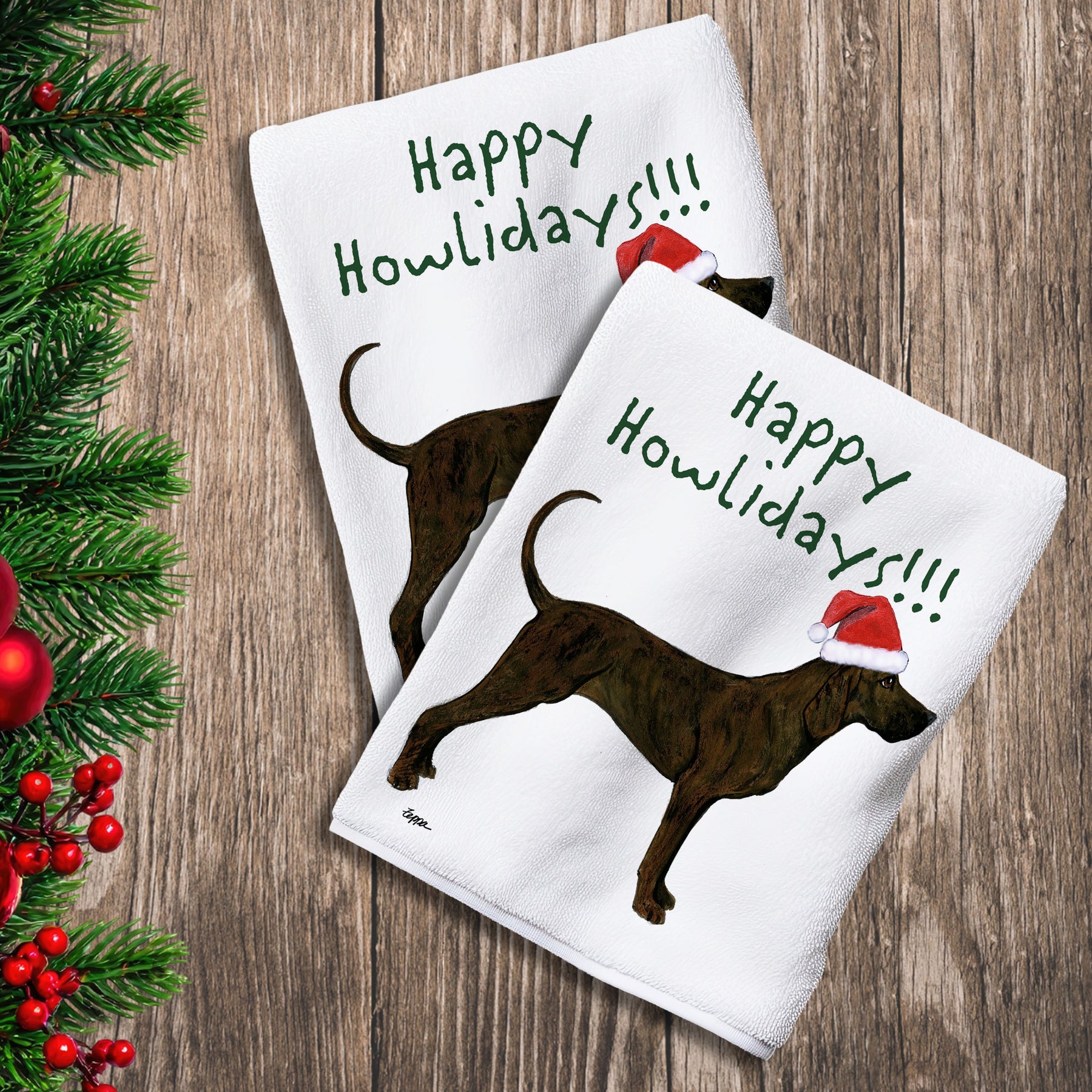 2 Kitchen Towels with a Plott Hound in a Santa Hat and Happy Howlidays text.