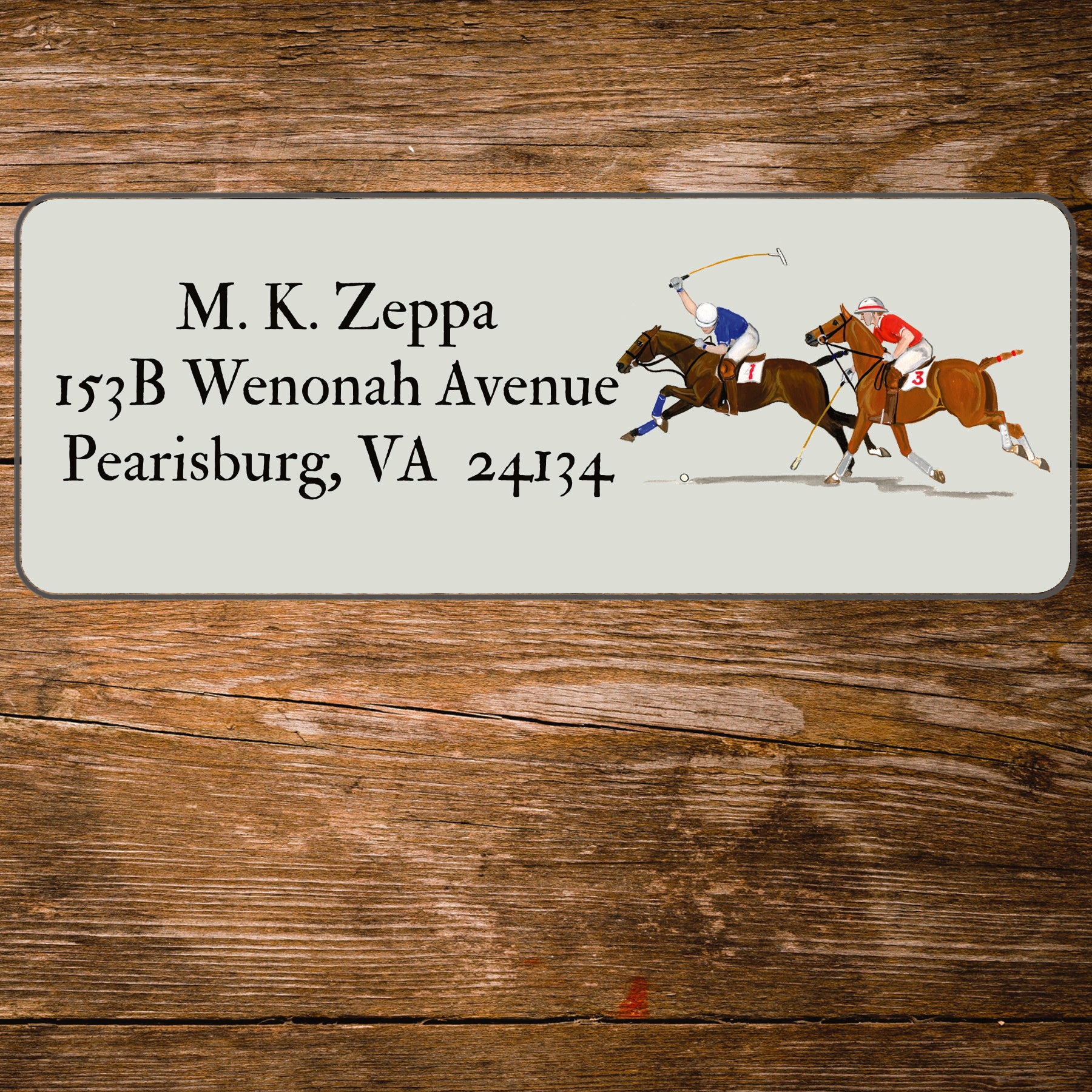 Address label with a polo players illustration on a wooden background