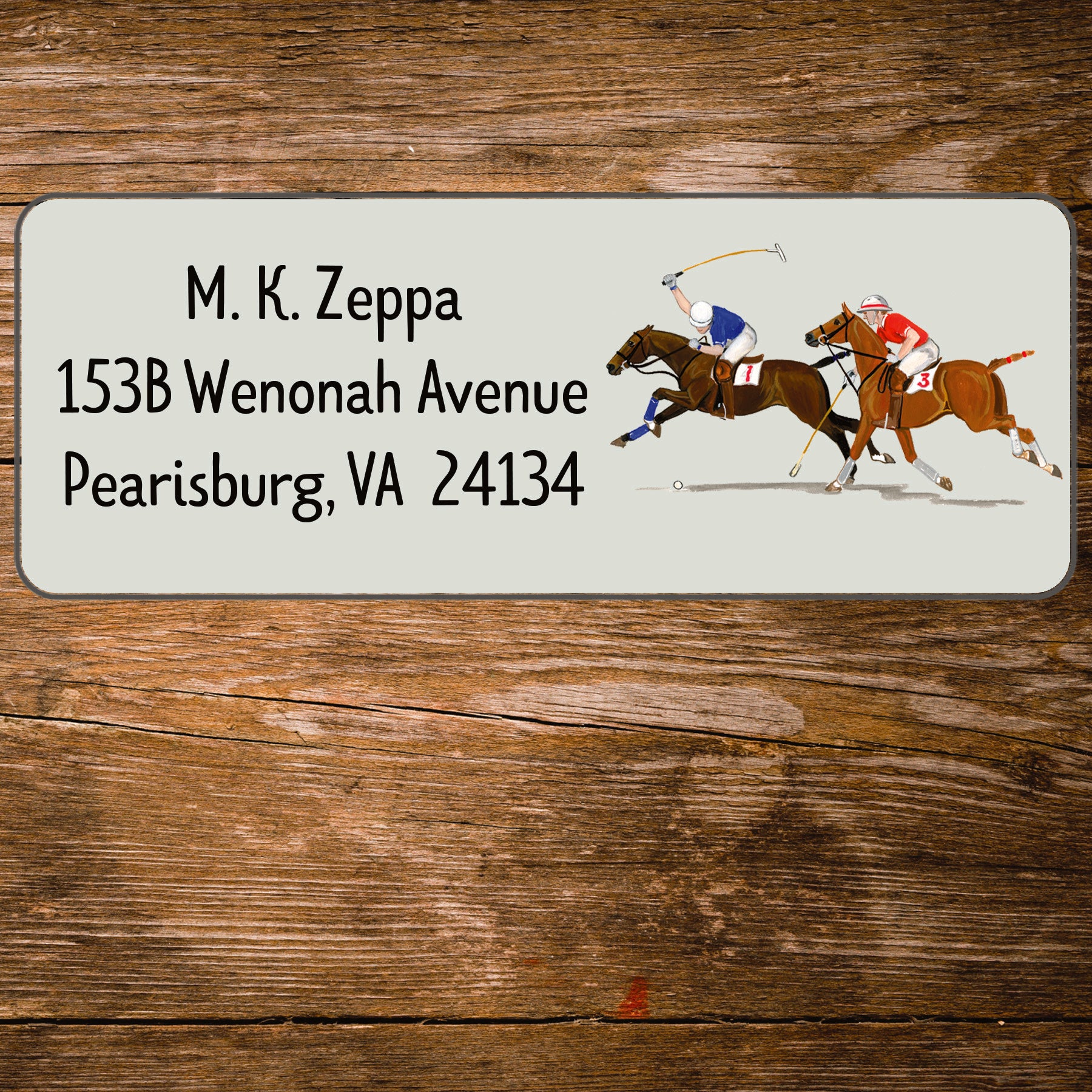 Address label with a polo players illustration on a wooden background