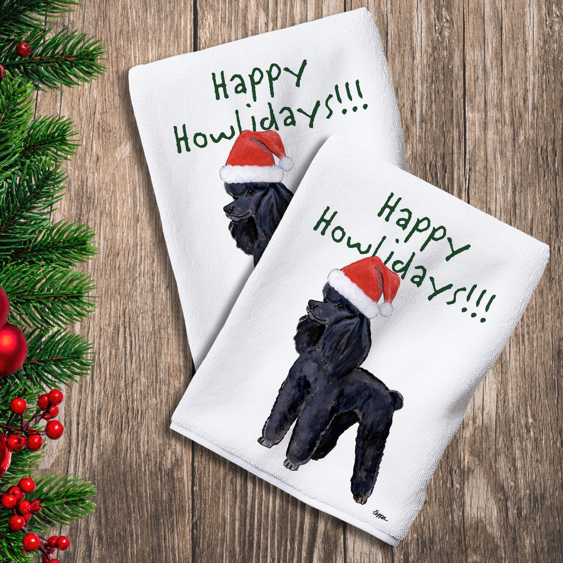 2 Kitchen Towels with a black Poodle in a Santa Hat and Happy Howlidays text.
