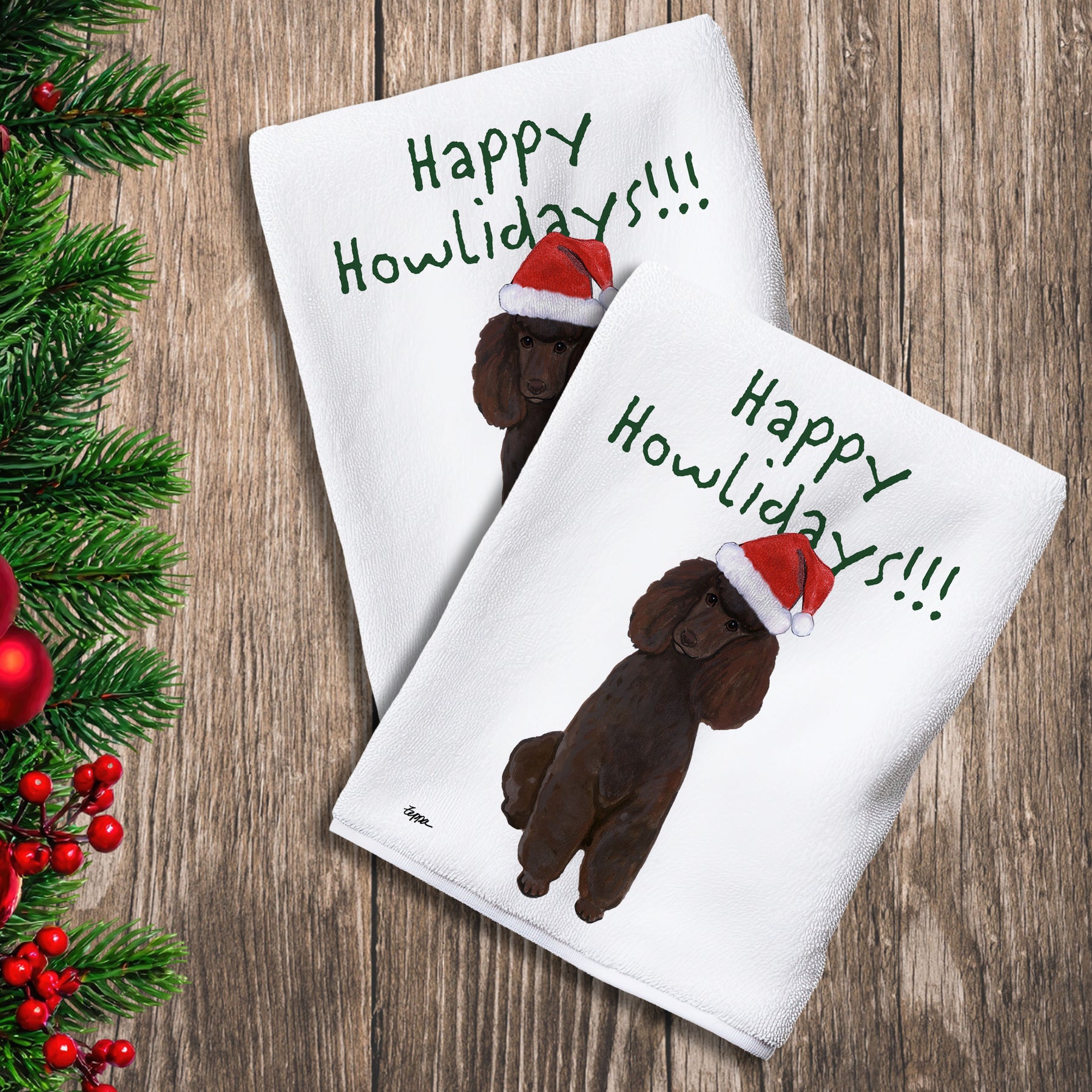 2 Kitchen Towels with a chocolate Poodle in a Santa Hat and Happy Howlidays text.

