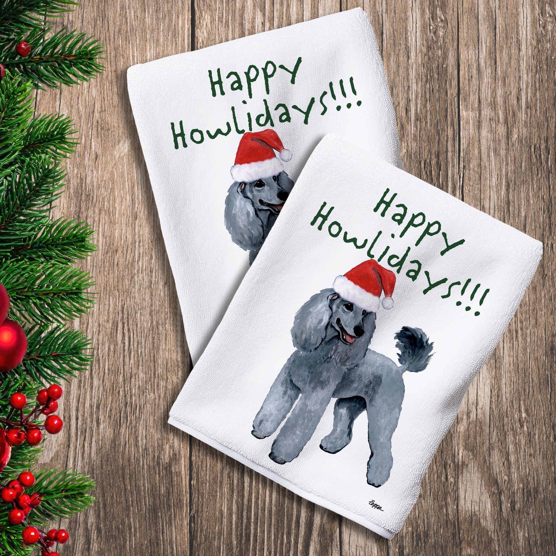2 Kitchen Towels with a silver Poodle in a Santa Hat and Happy Howlidays text.
