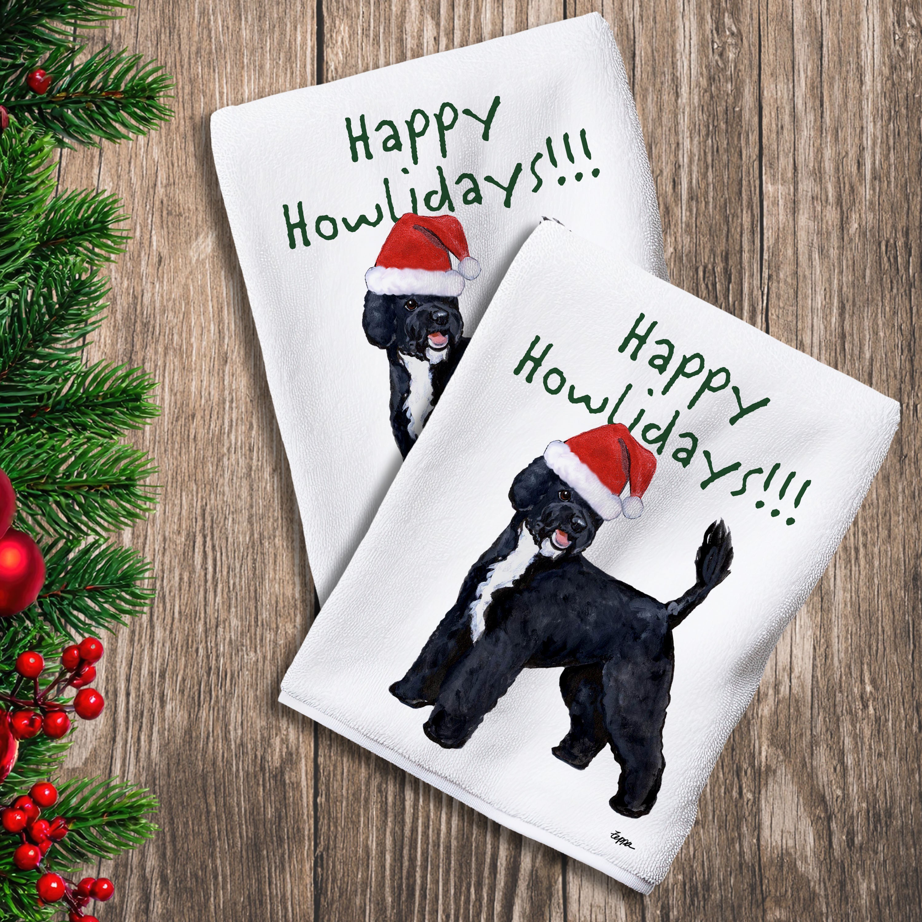 2 Kitchen Towels with a Portuguese Water Dog in a Santa Hat and Happy Howlidays text.

