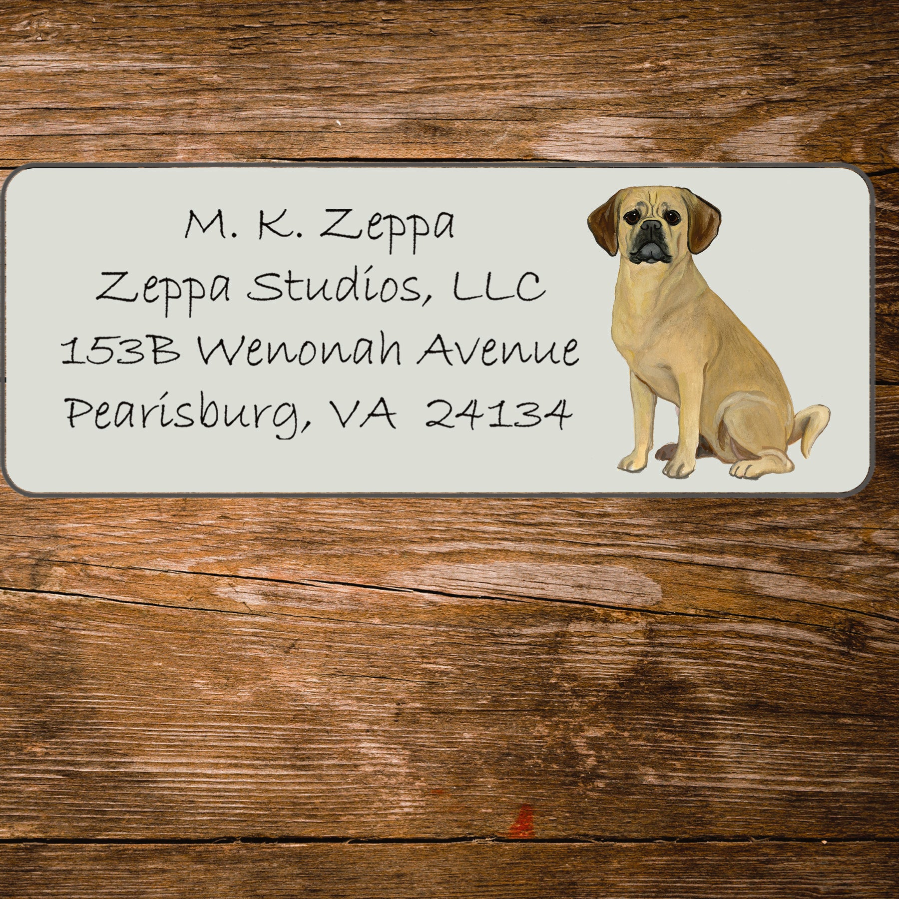 Return address label with an illustration of a Puggle.