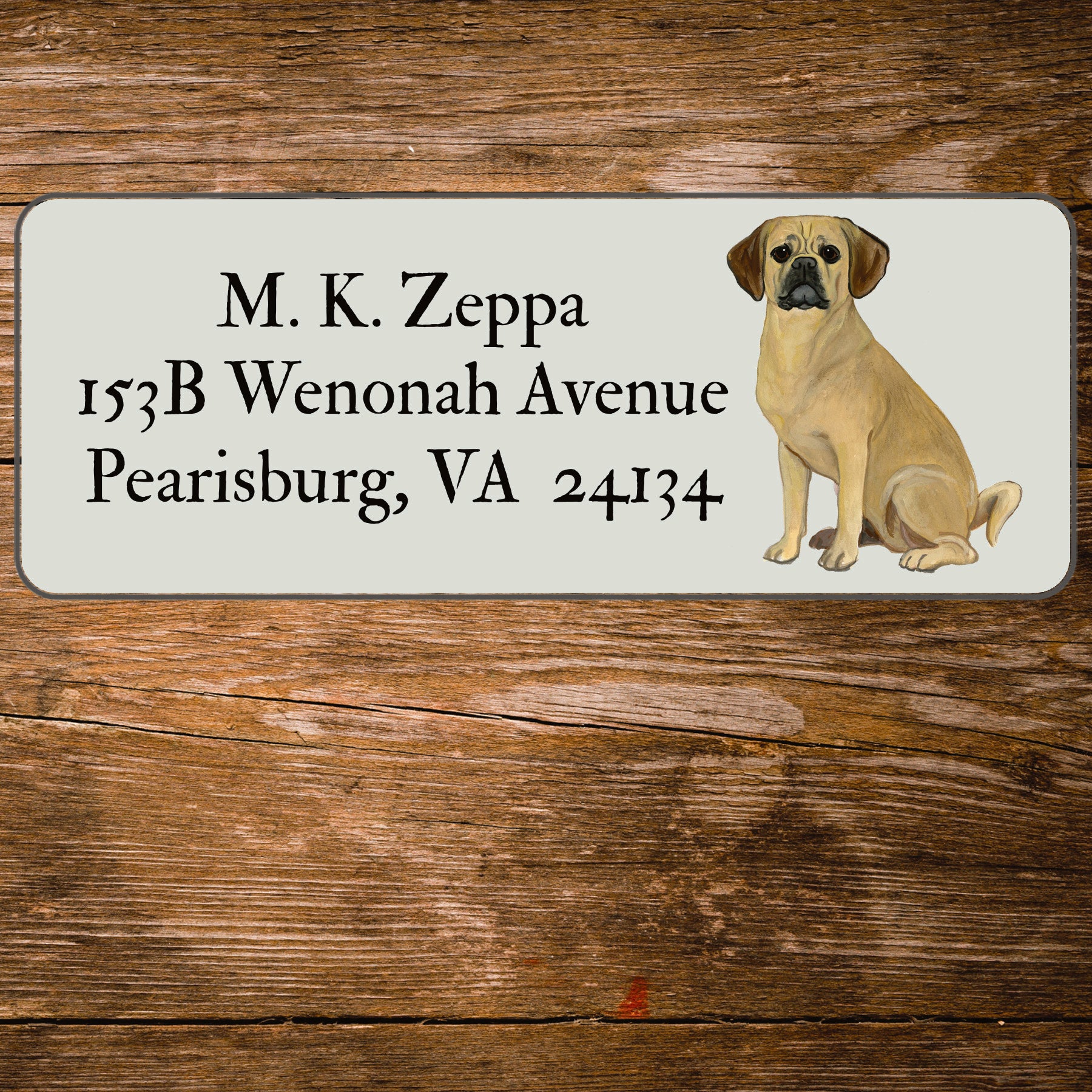 Return address label with an illustration of a Puggle.