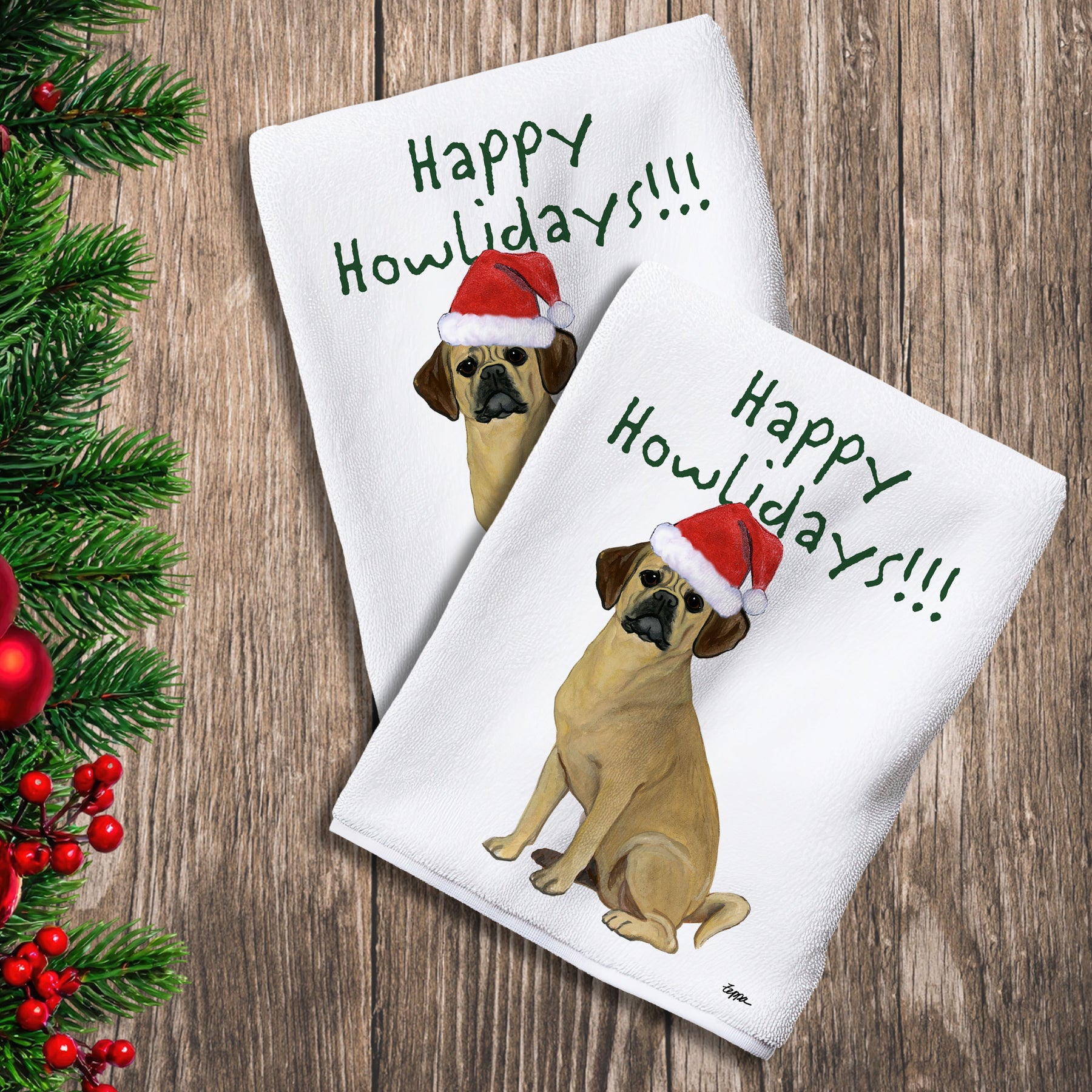 2 Kitchen Towels with a Puggle in a Santa Hat and Happy Howlidays text.
