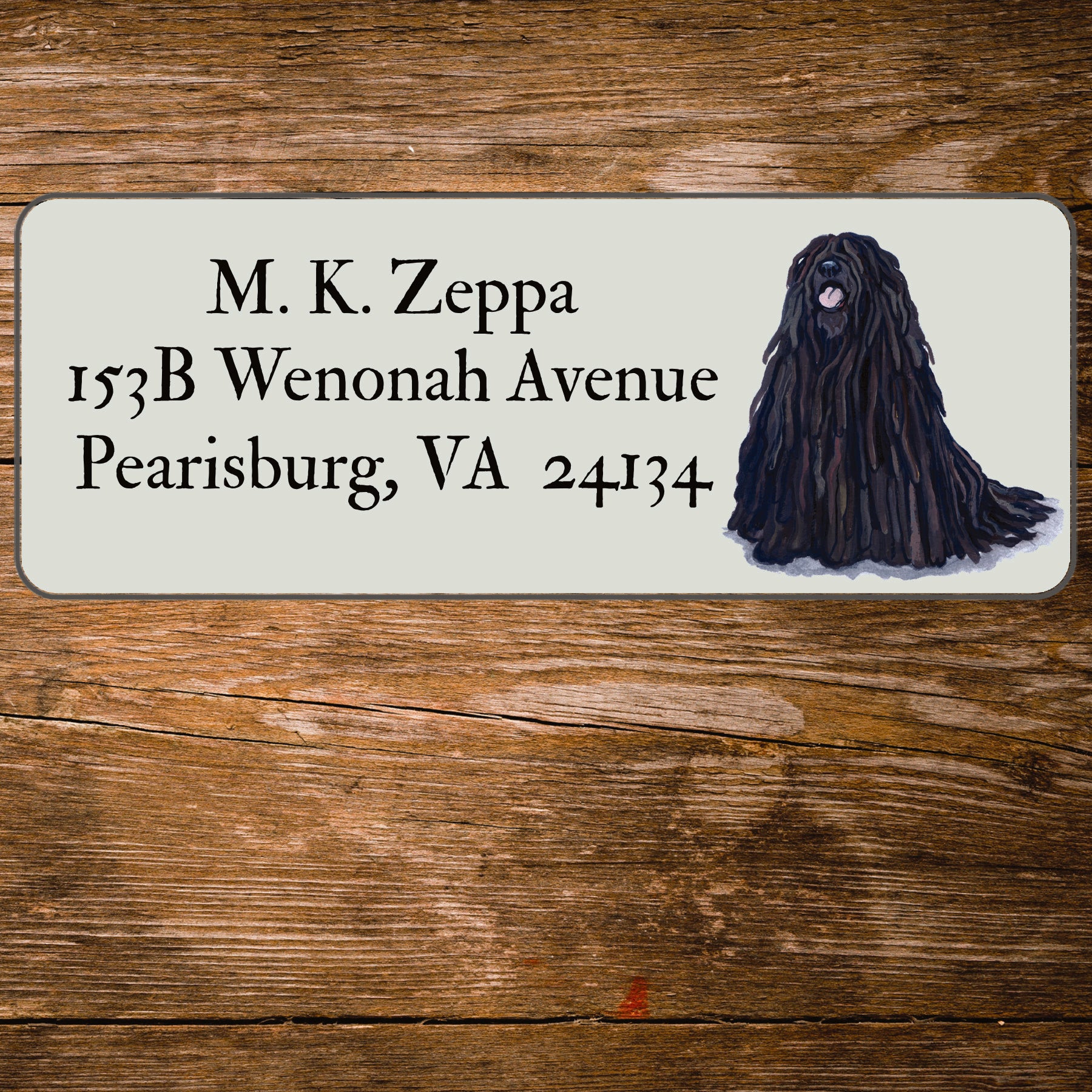 Return address label with a Puli illustration.