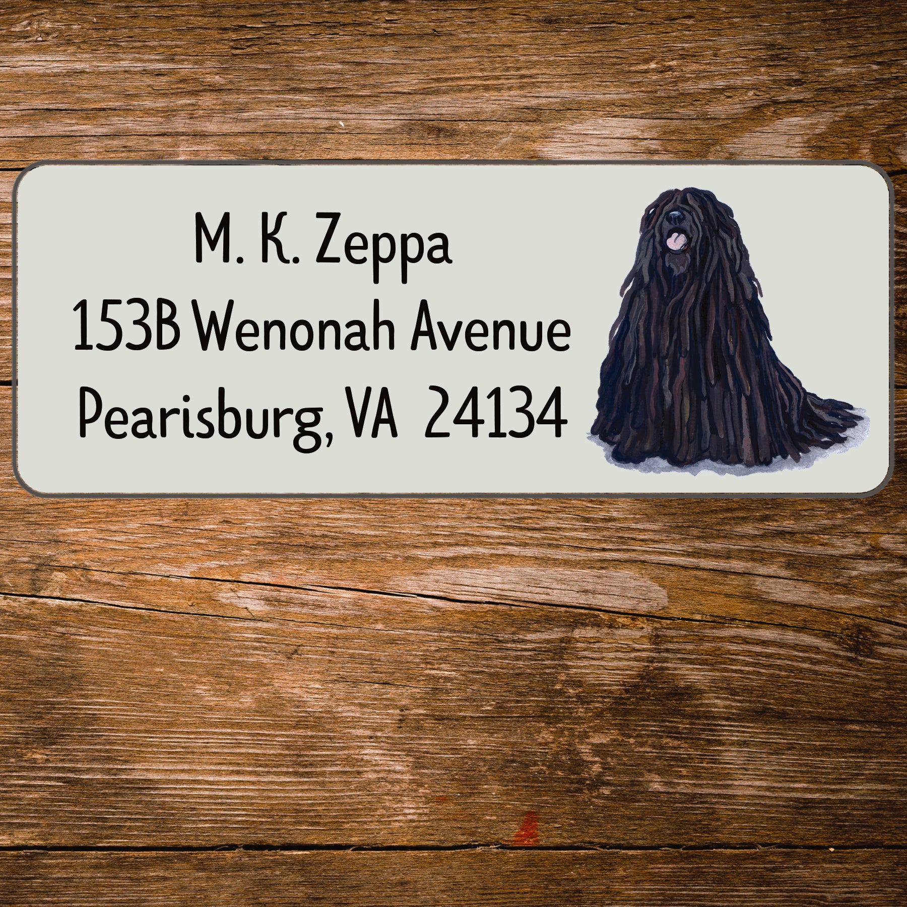 Return address label with a Puli illustration.