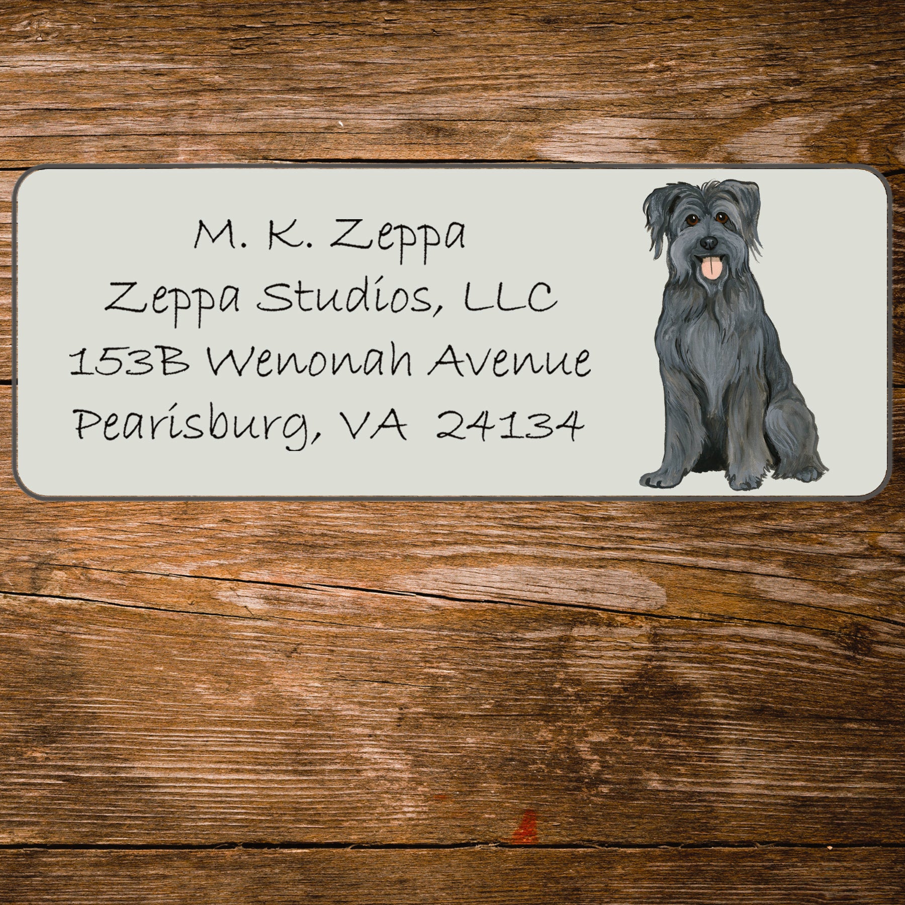 Return address label with an illustration of a Pyrenean Shepherd Dog.