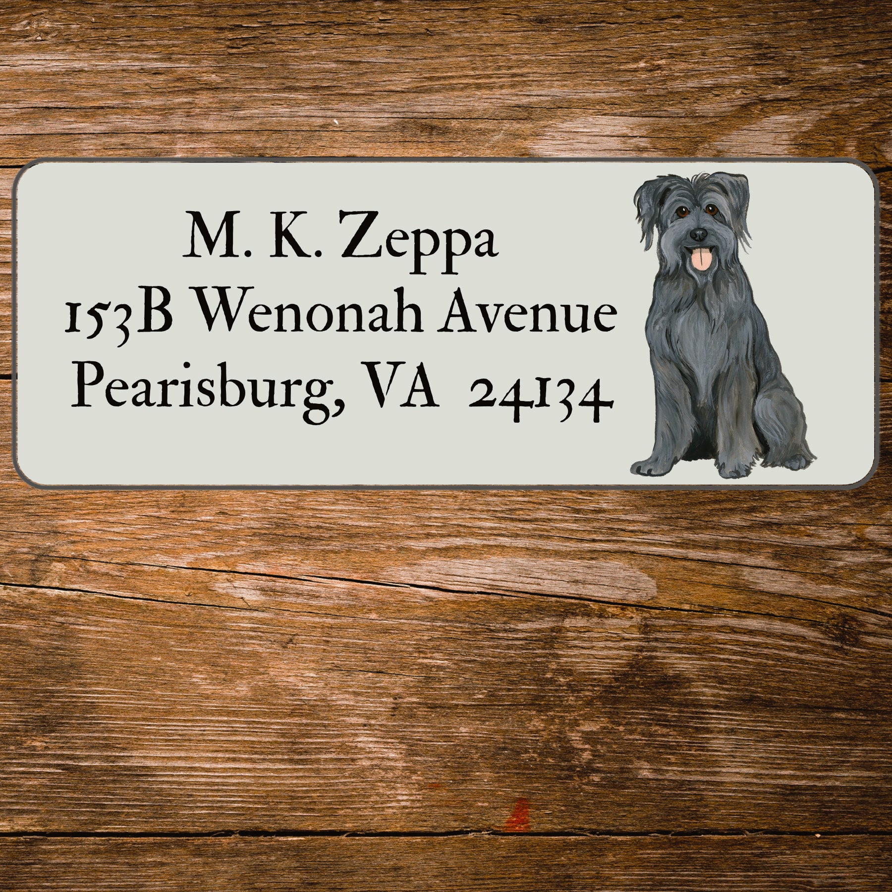 Return address label with an illustration of a Pyrenean Shepherd Dog.