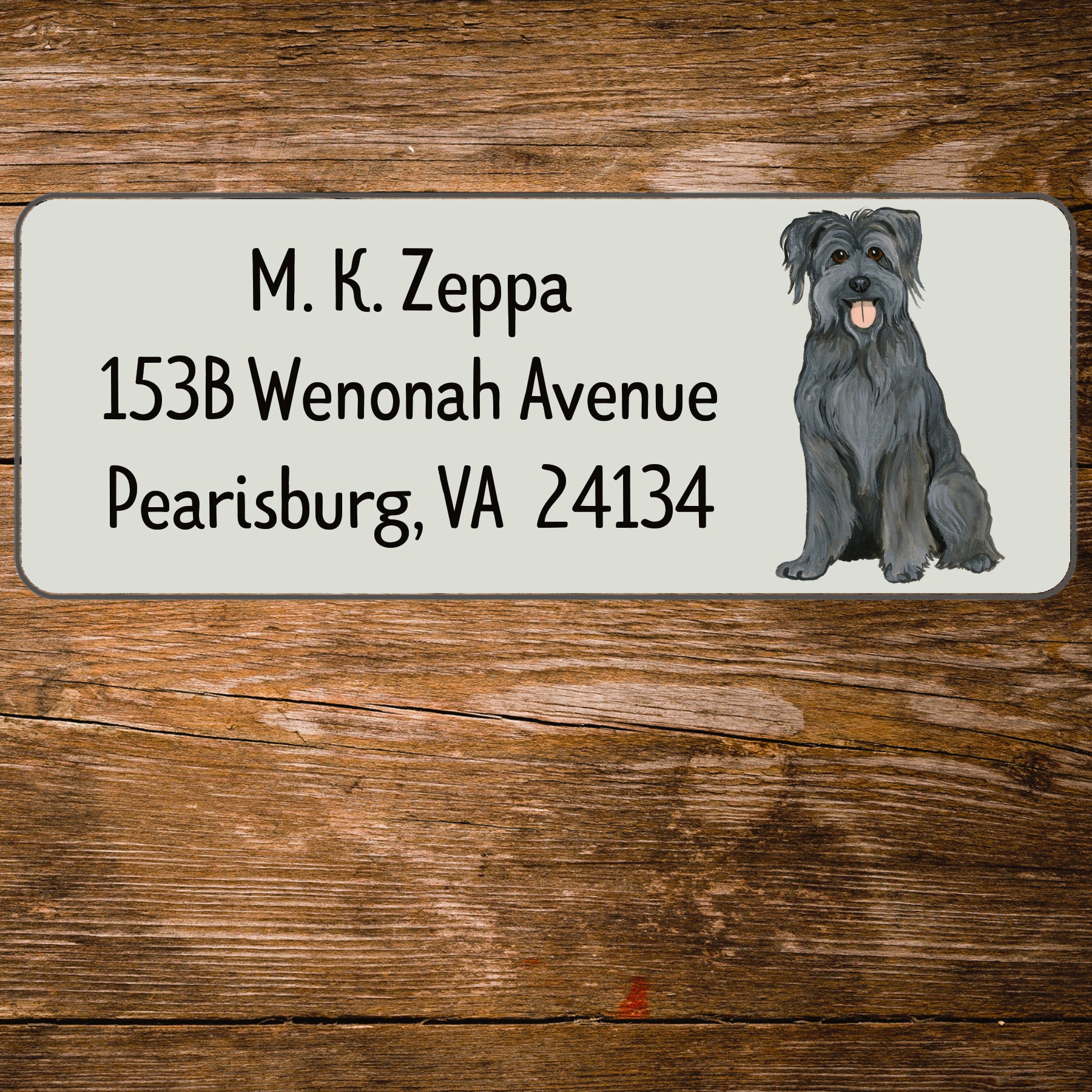 Return address label with an illustration of a Pyrenean Shepherd Dog.