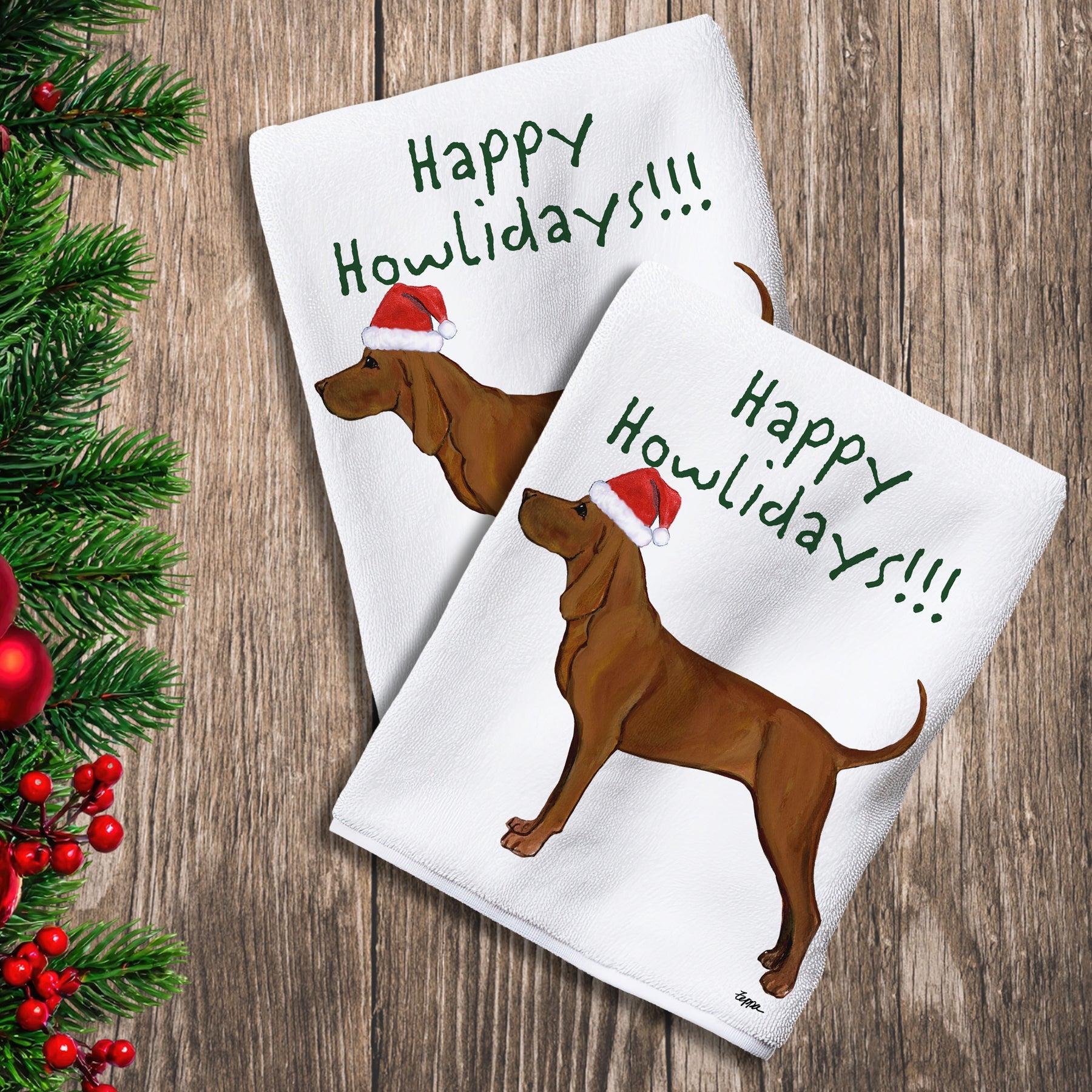 2 Kitchen Towels with a Redbone Coonhound in a Santa Hat and Happy Howlidays text.

