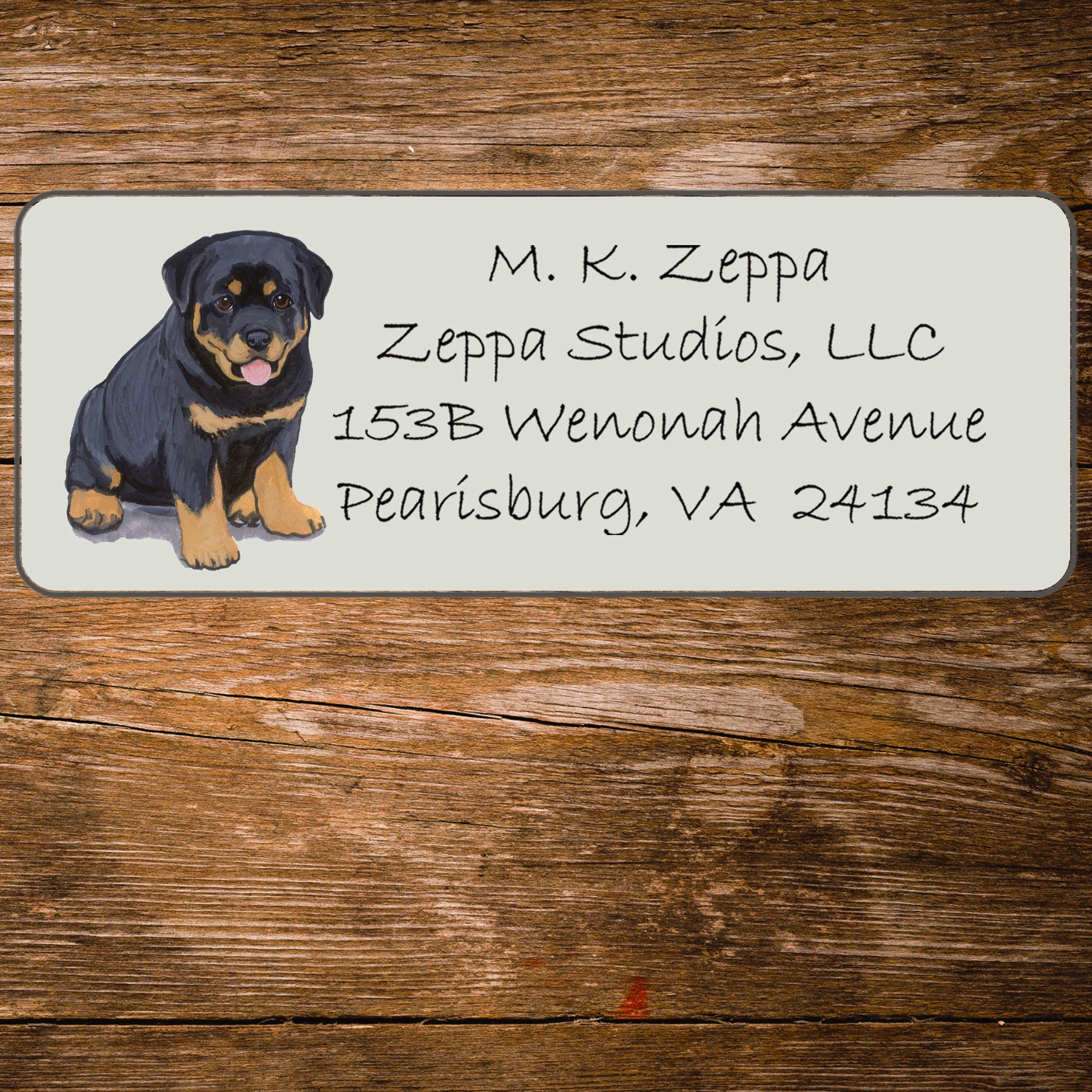 Return address label with a Rottweiler illustration.