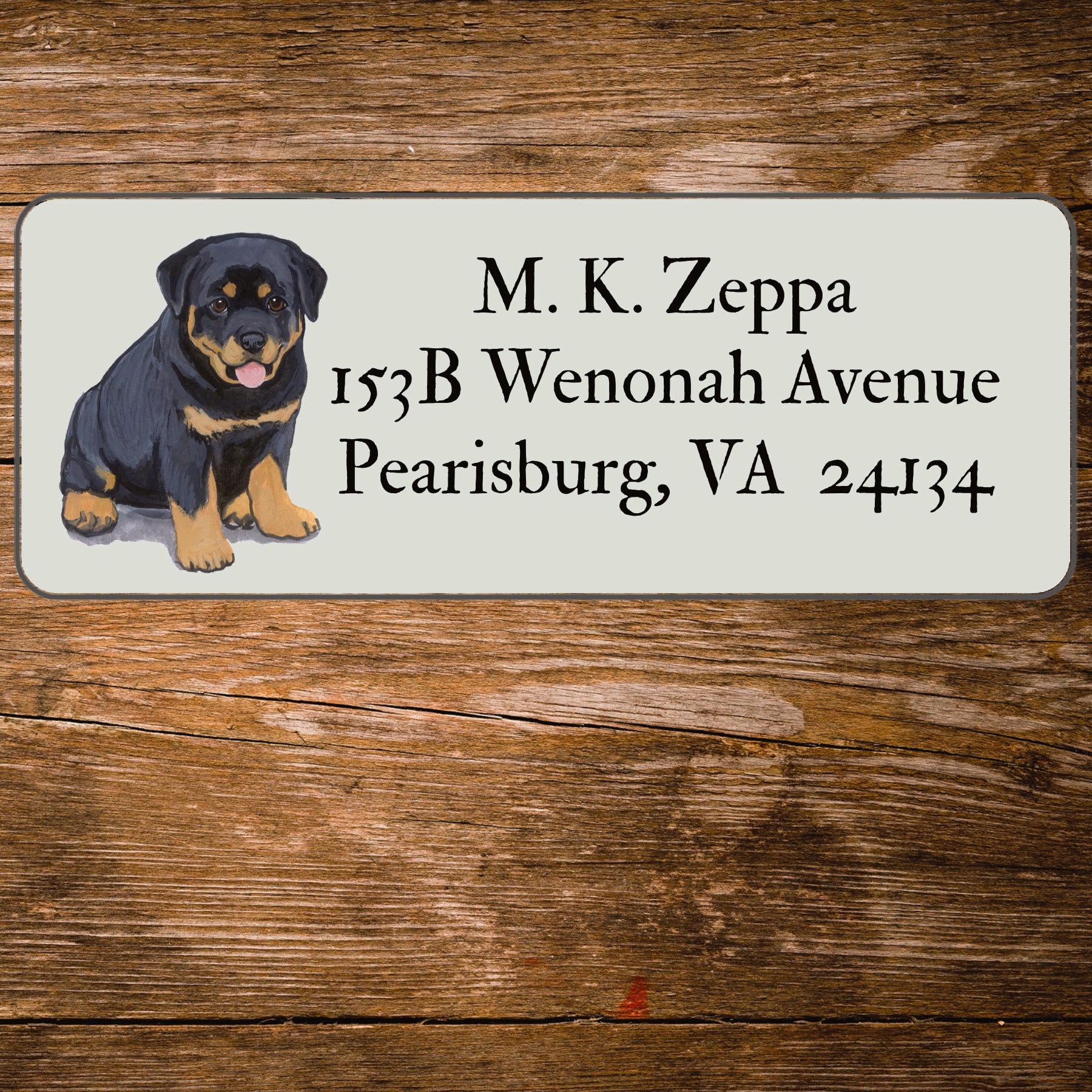 Return address label with a Rottweiler illustration.