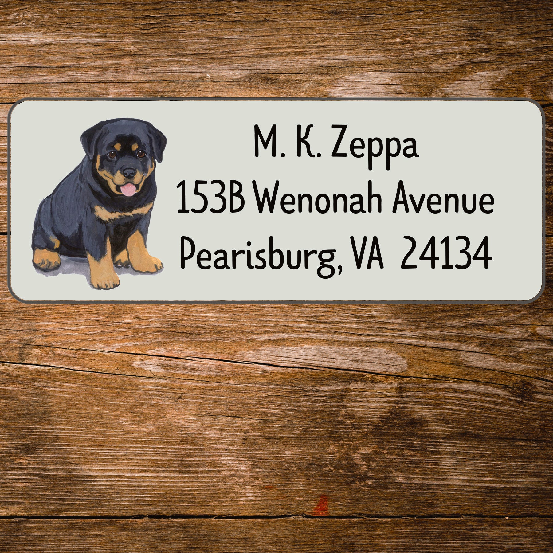 Return address label with a Rottweiler illustration.