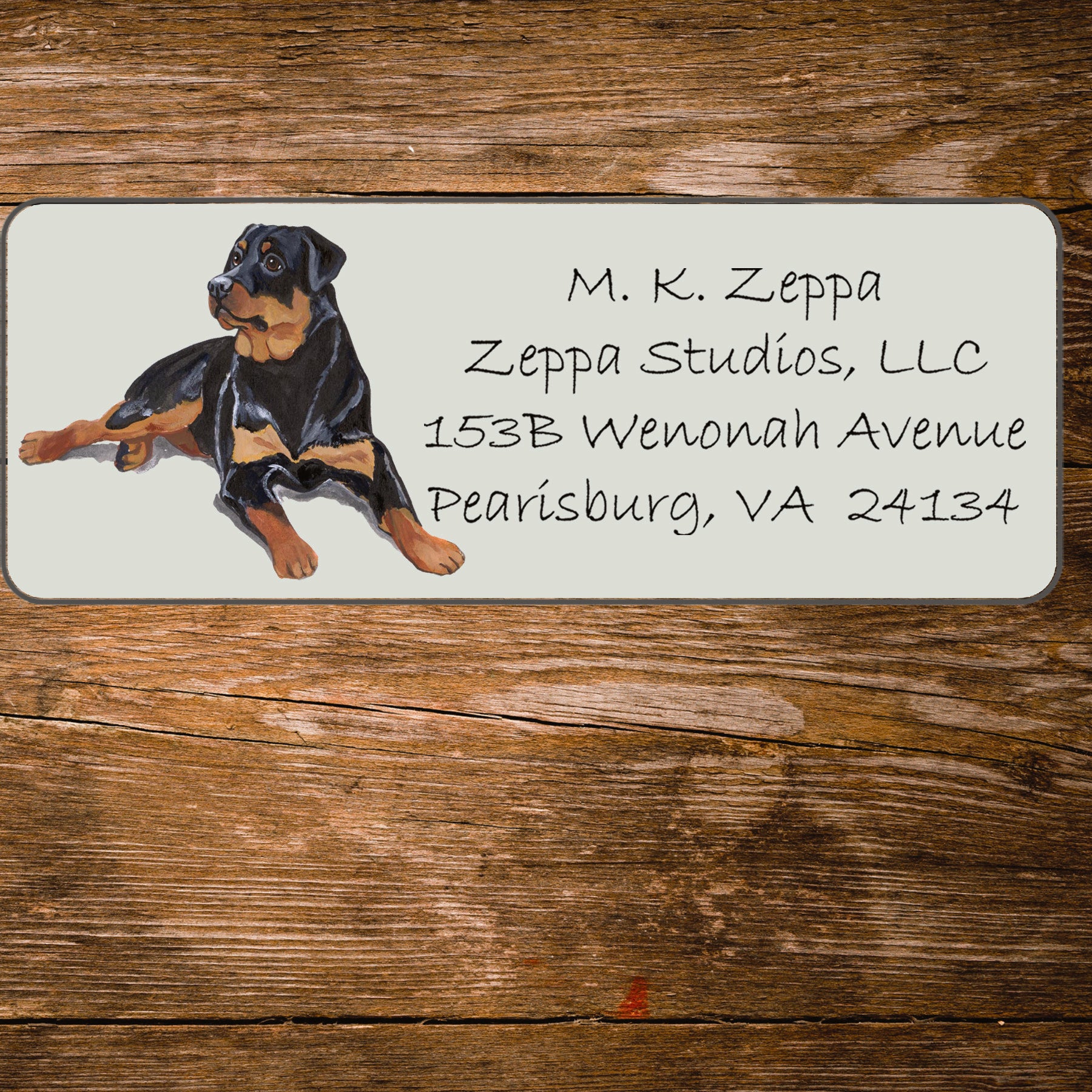 Return address label with a Rottweiler illustration.