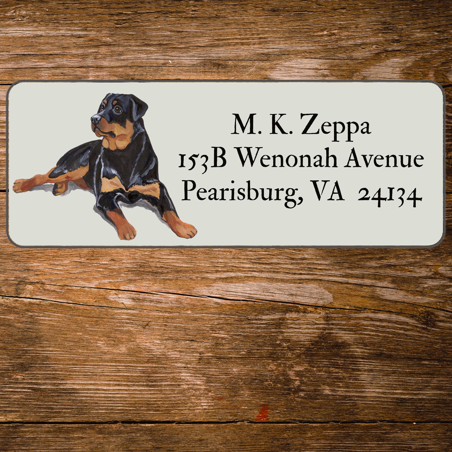 Return address label with a Rottweiler illustration.