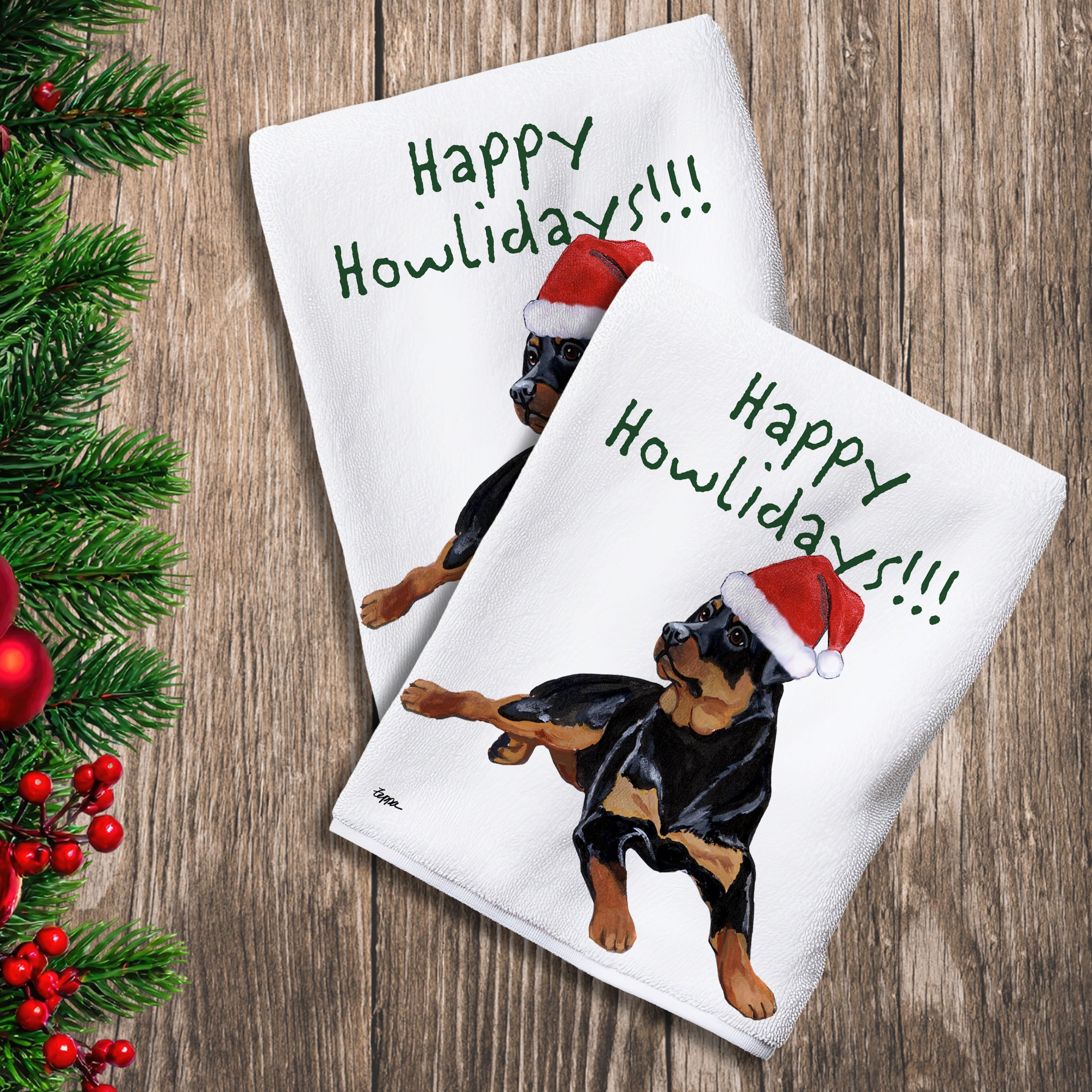 2 Kitchen Towels with a Rottweiler in a Santa Hat and Happy Howlidays text.
