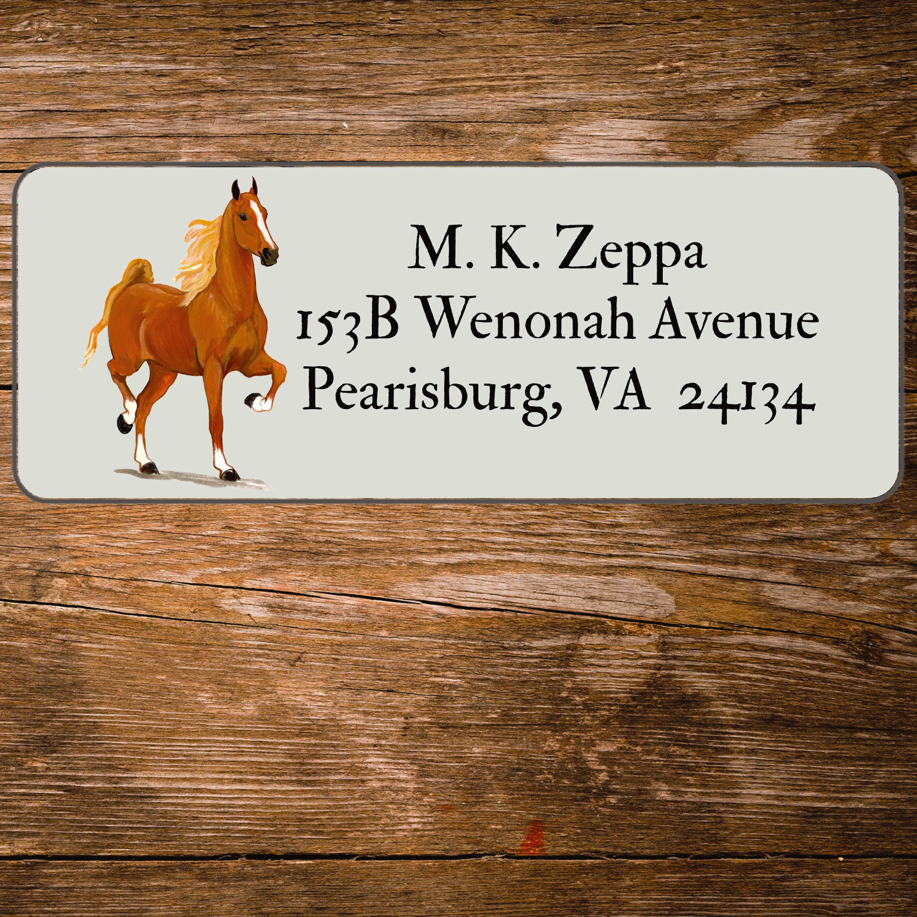 Address label with an antique horse race illustration on a wooden background