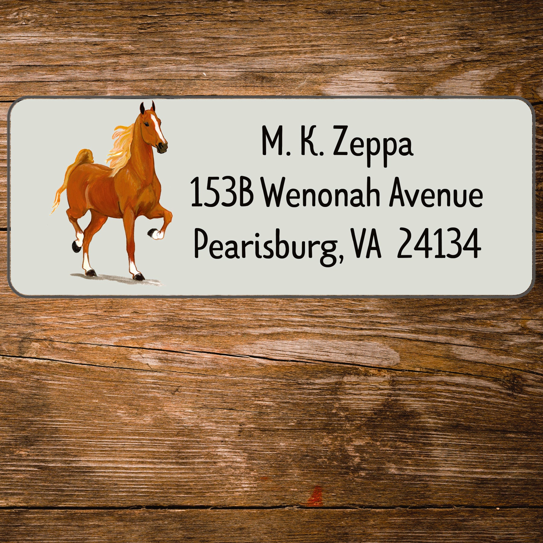 Address label with an antique horse race illustration on a wooden background