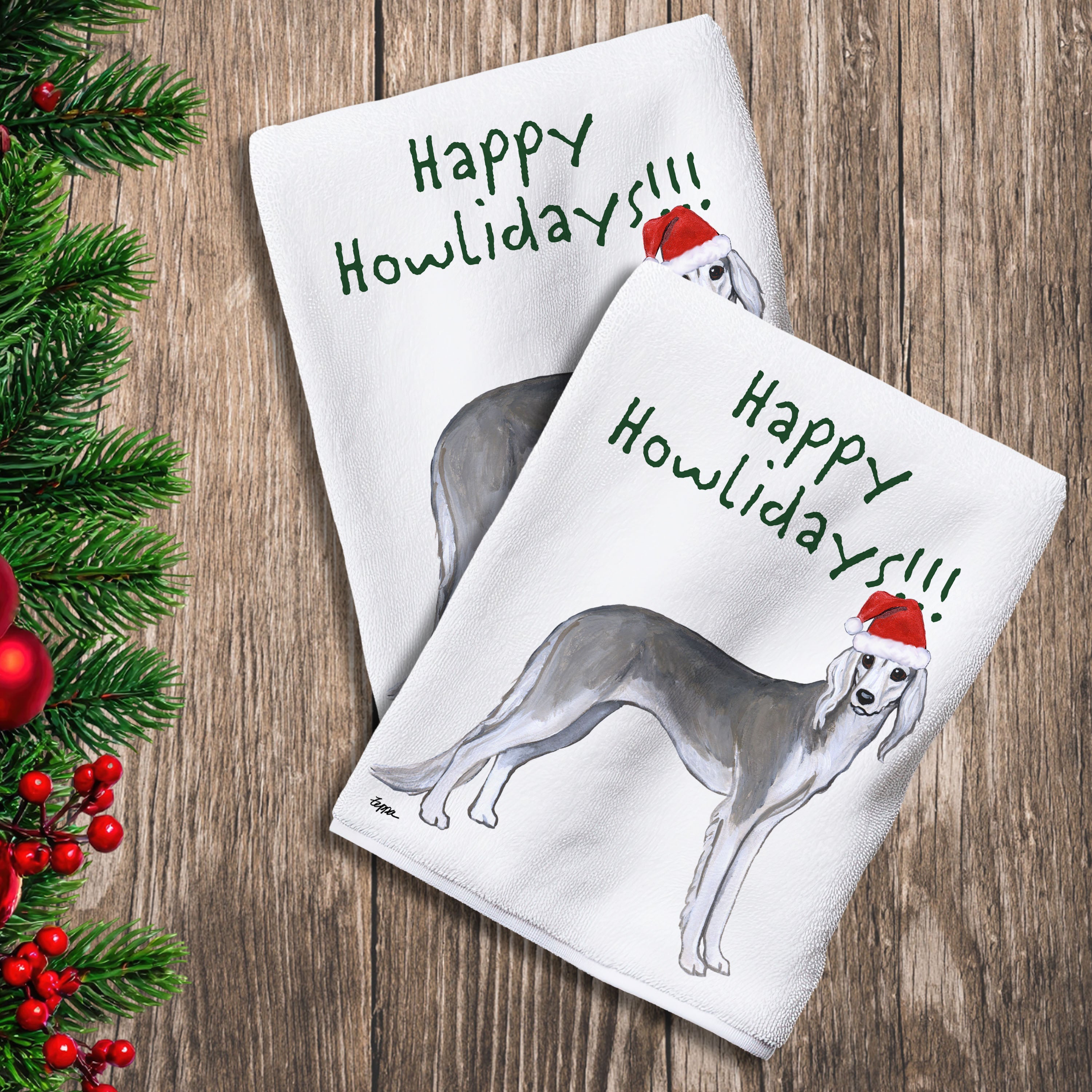 2 Kitchen Towels with a Saluki in a Santa Hat and Happy Howlidays text.
