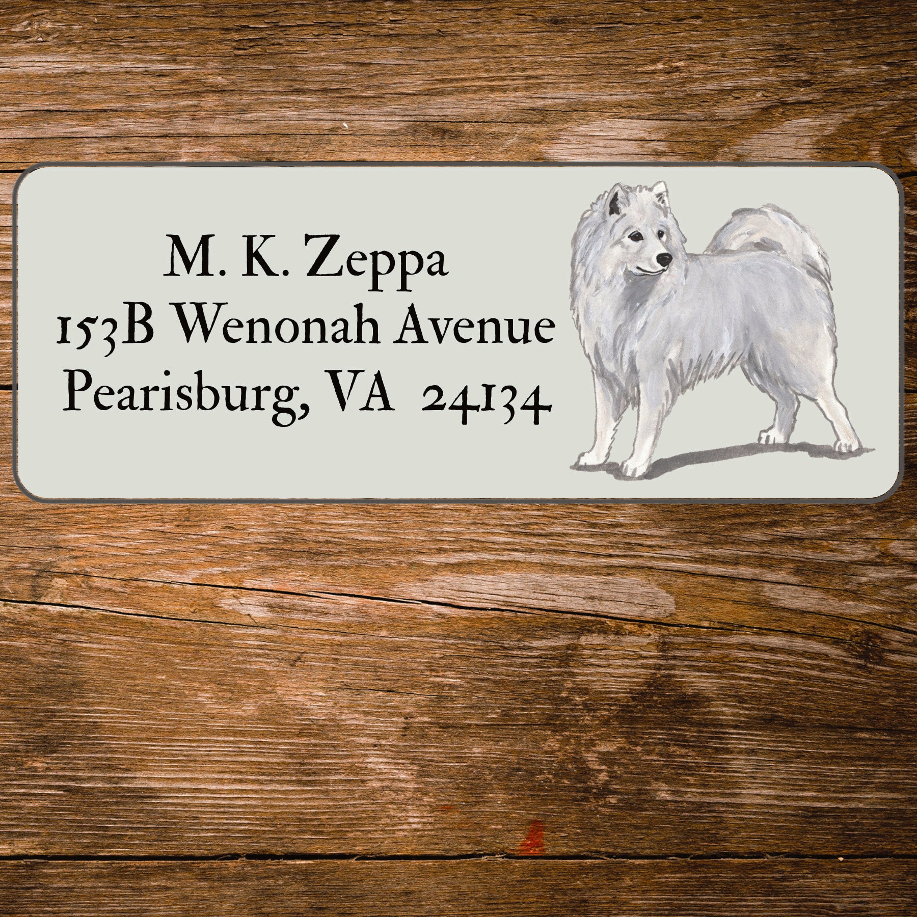 Return address label with a Samoyed illustration.