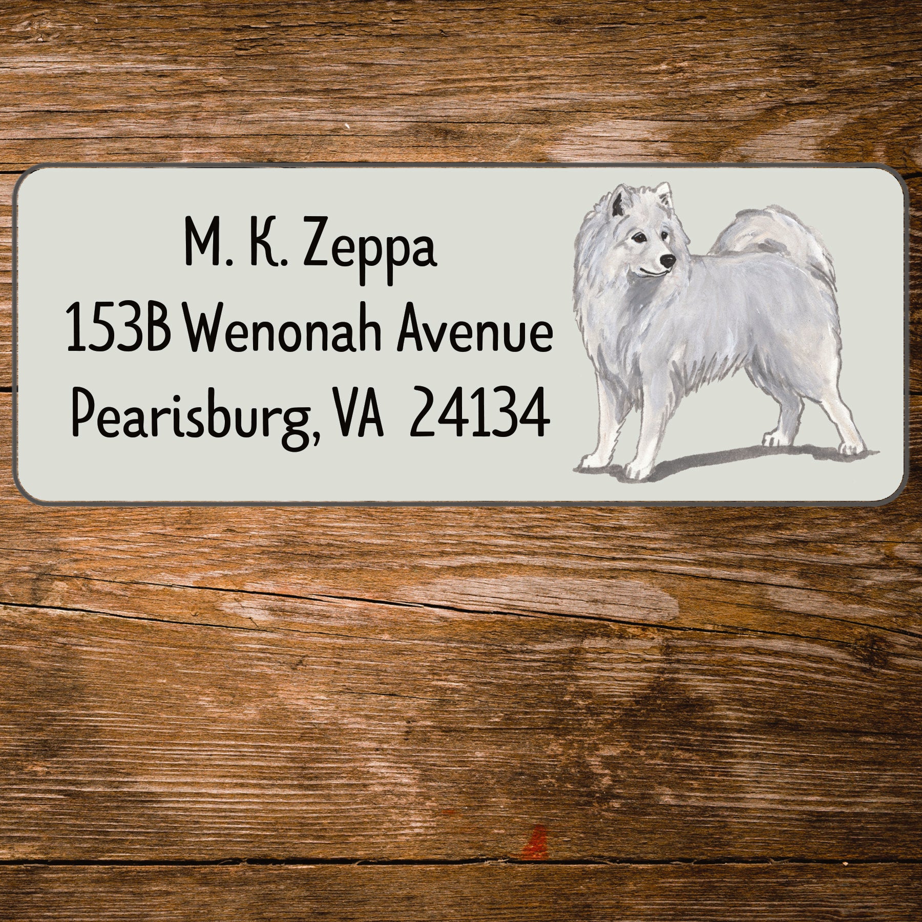 Return address label with a Samoyed illustration.