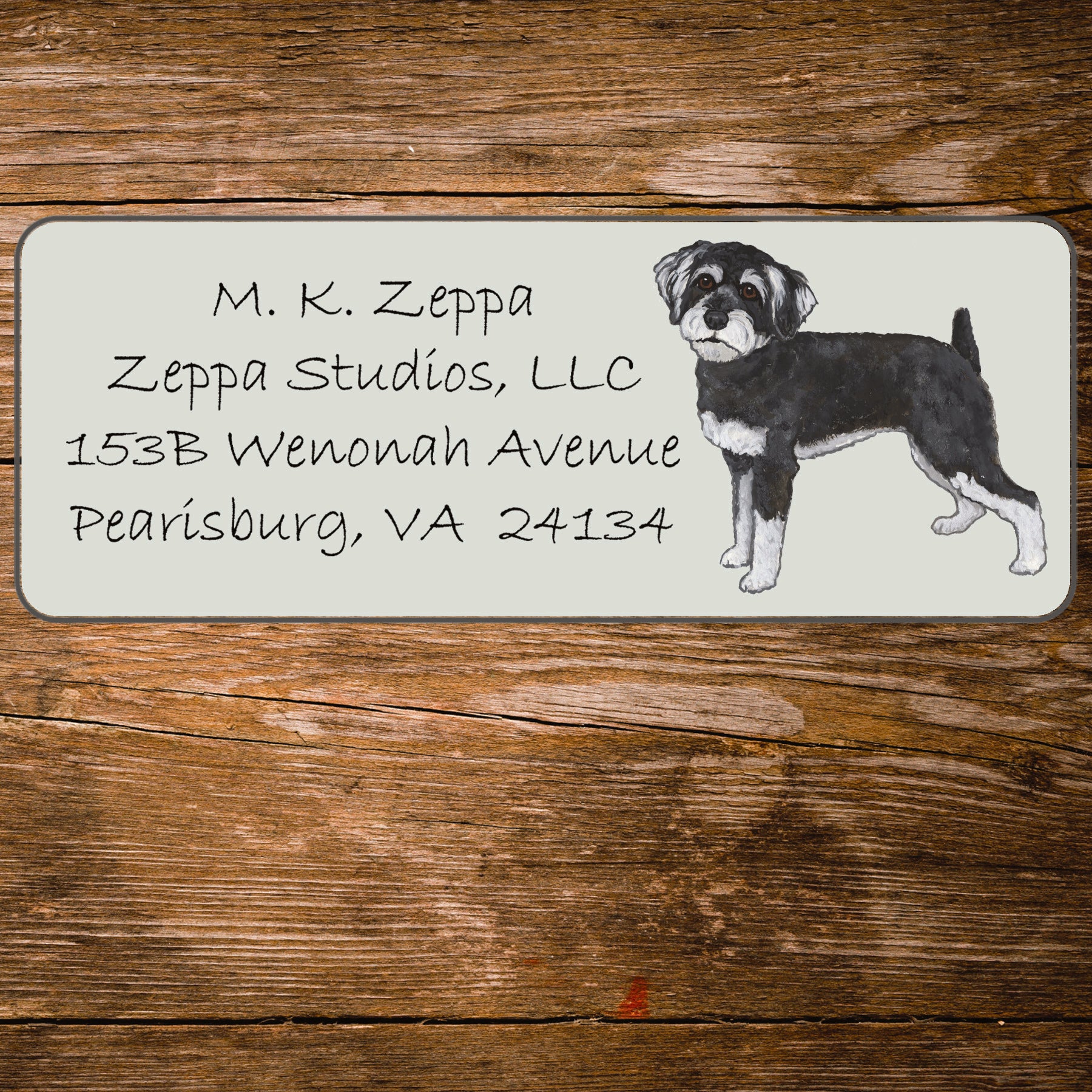 Return address label with an illustration of a Schnoodle