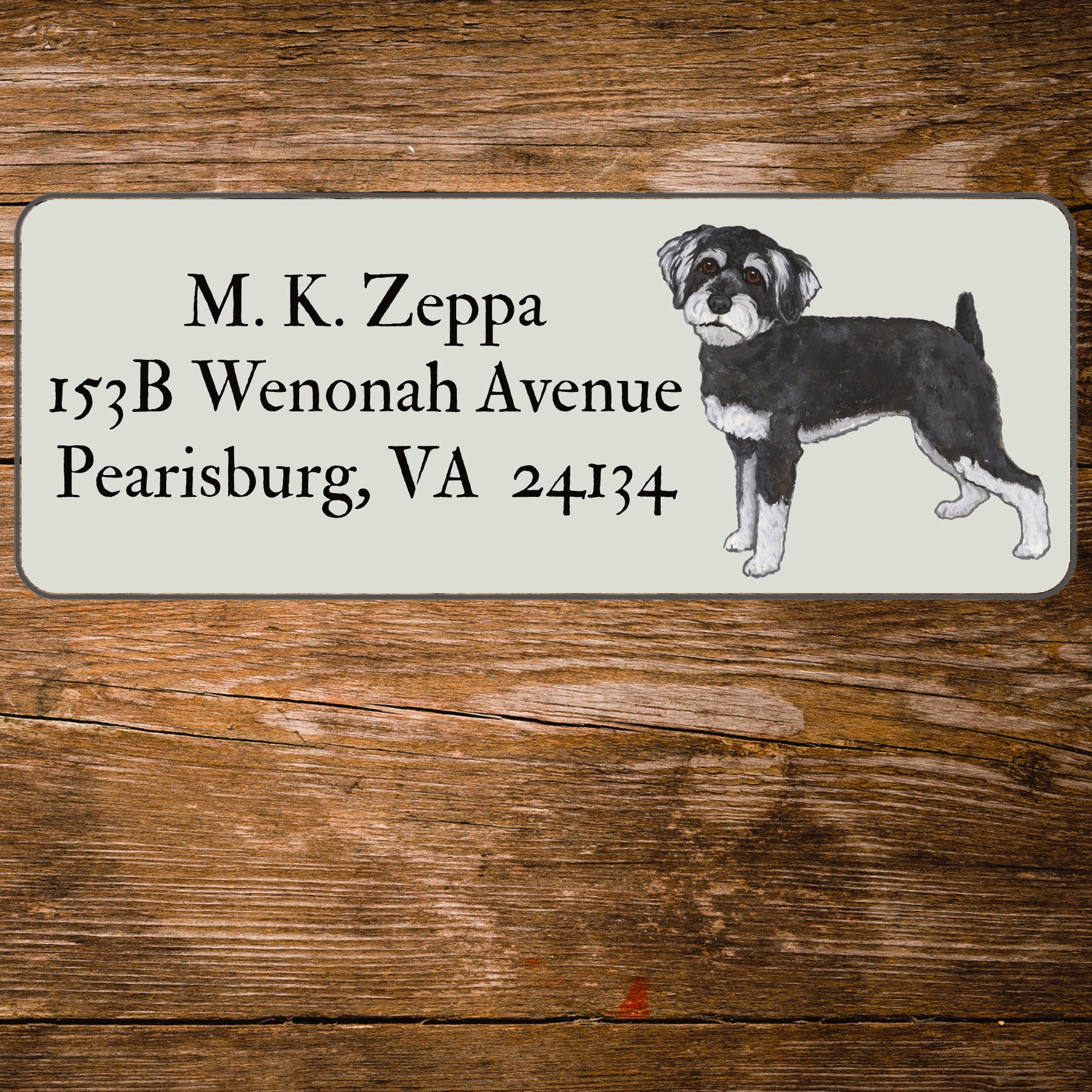 Return address label with an illustration of a Schnoodle