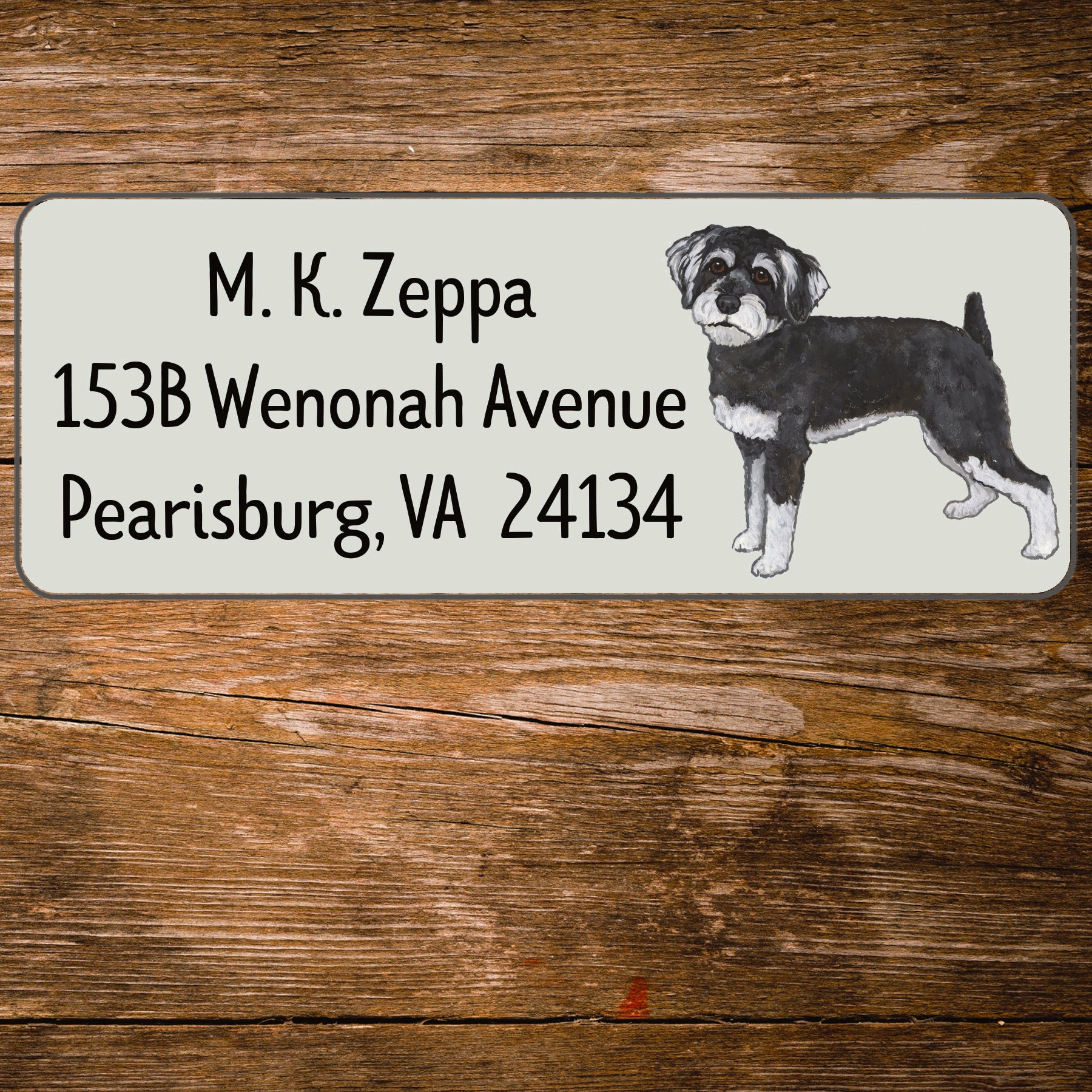 Return address label with an illustration of a Schnoodle