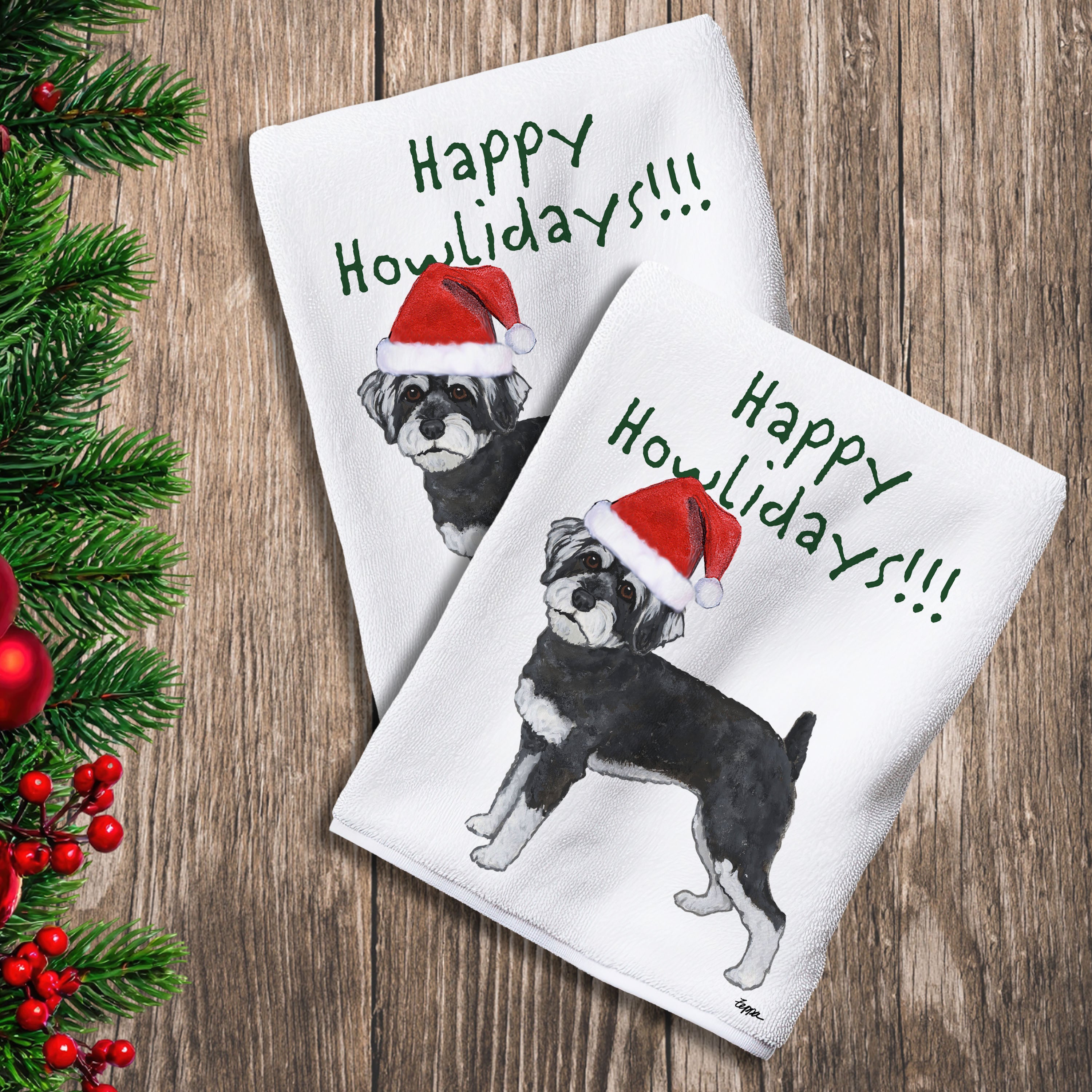 2 Kitchen Towels with a Schnoodle in a Santa Hat and Happy Howlidays text.